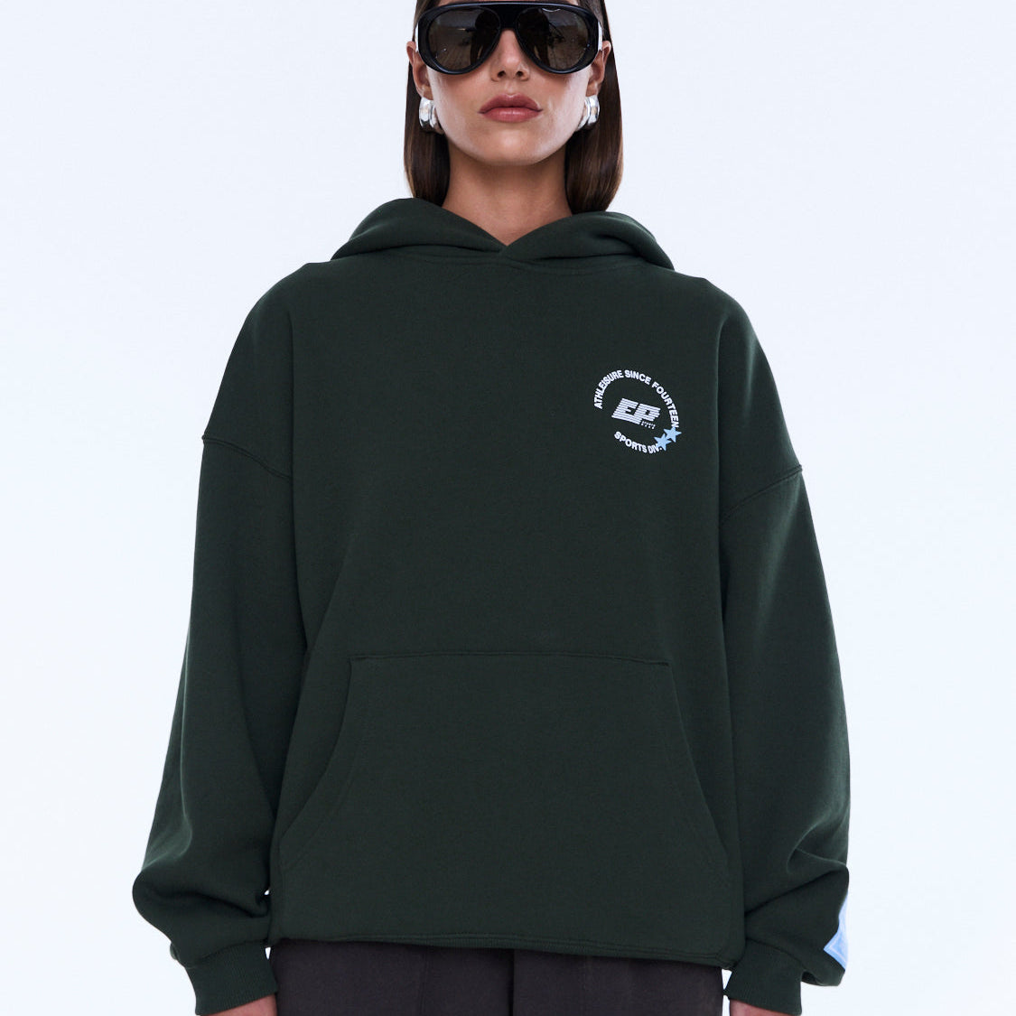 Front view of moss green Aries Hoodie with kangaroo pocket and relaxed fit