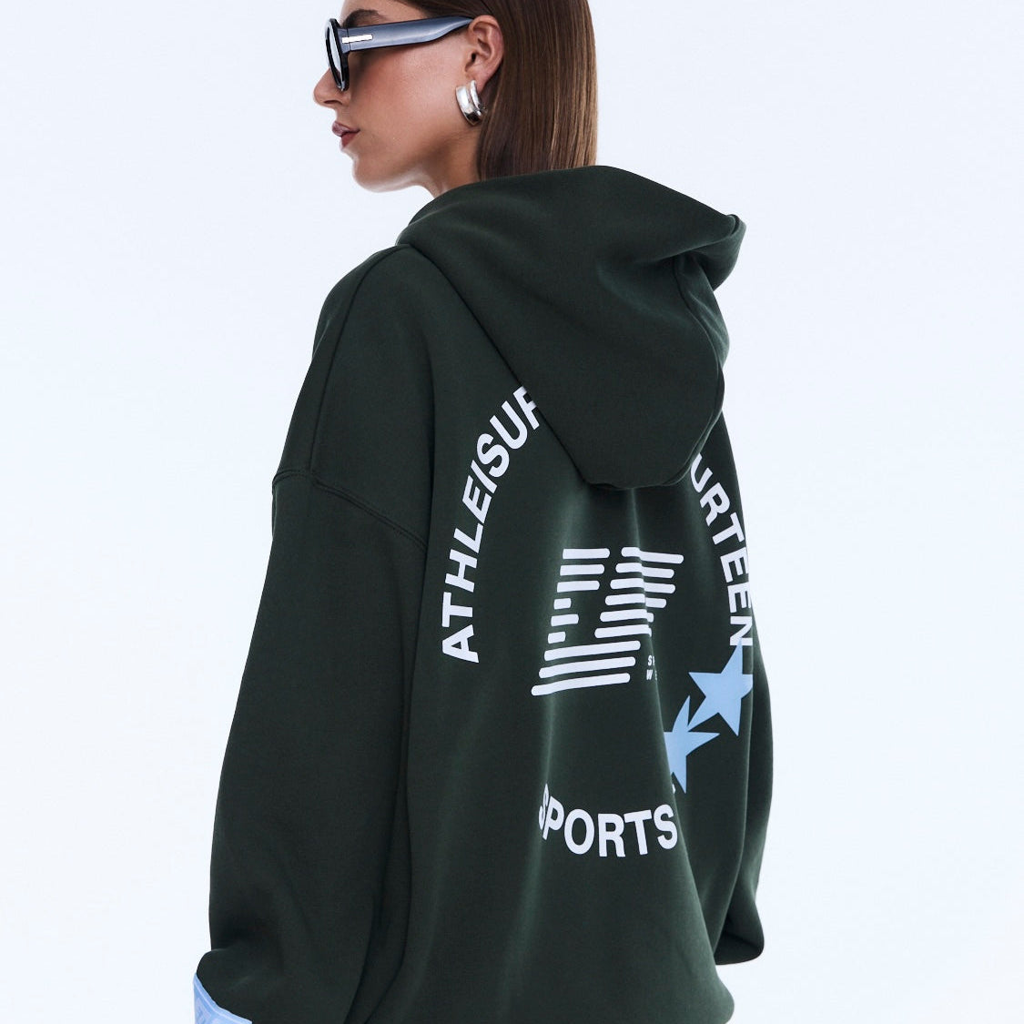 Three-quarter back view of Aries Hoodie displaying text and star graphic