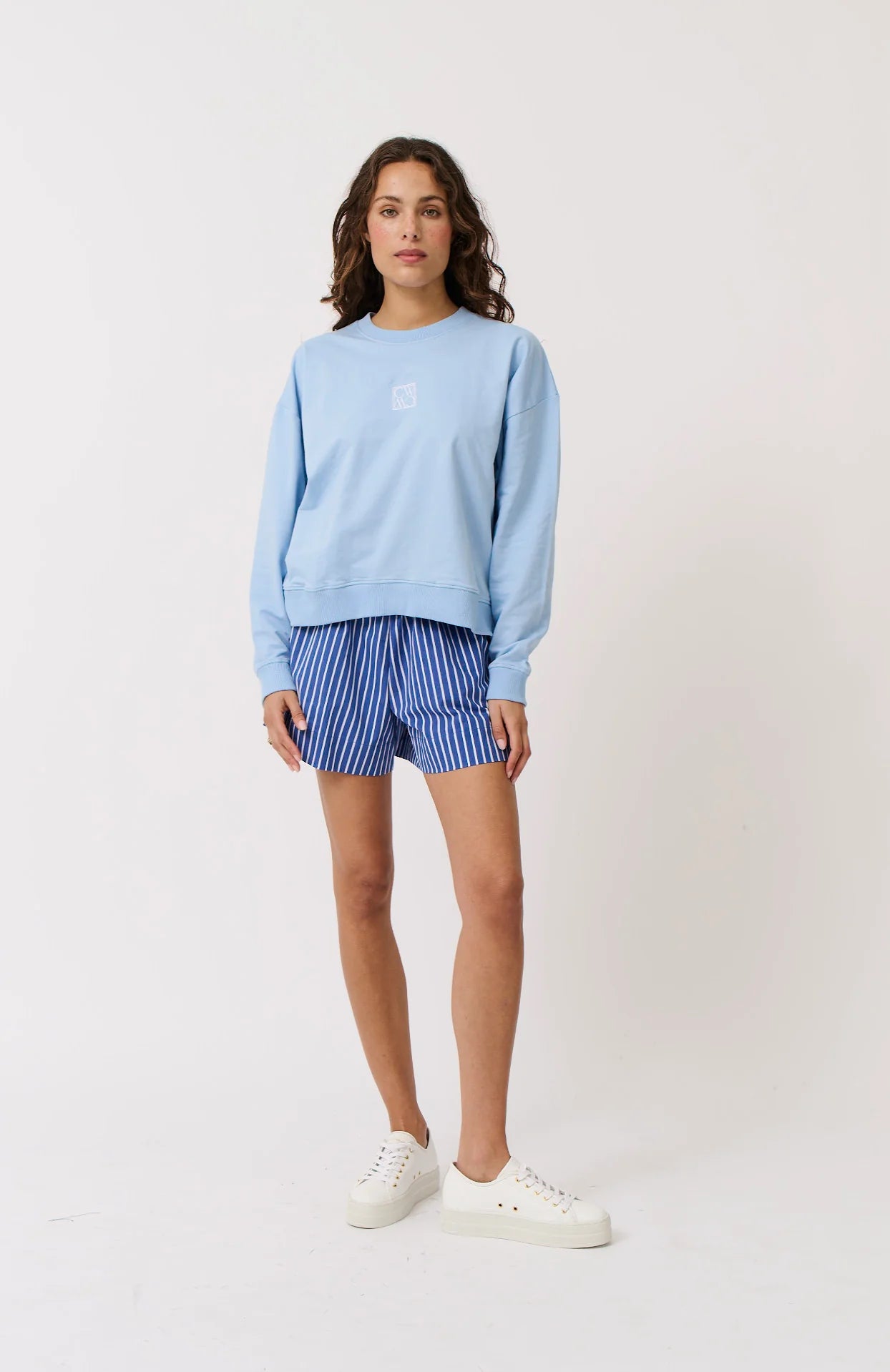 Light blue sweater with white embroidery from C&W
