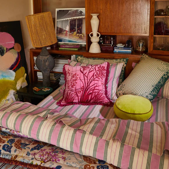 Adelyn Embroidered Cushion in Cosmo Pink by Sage & Clare display on lounge