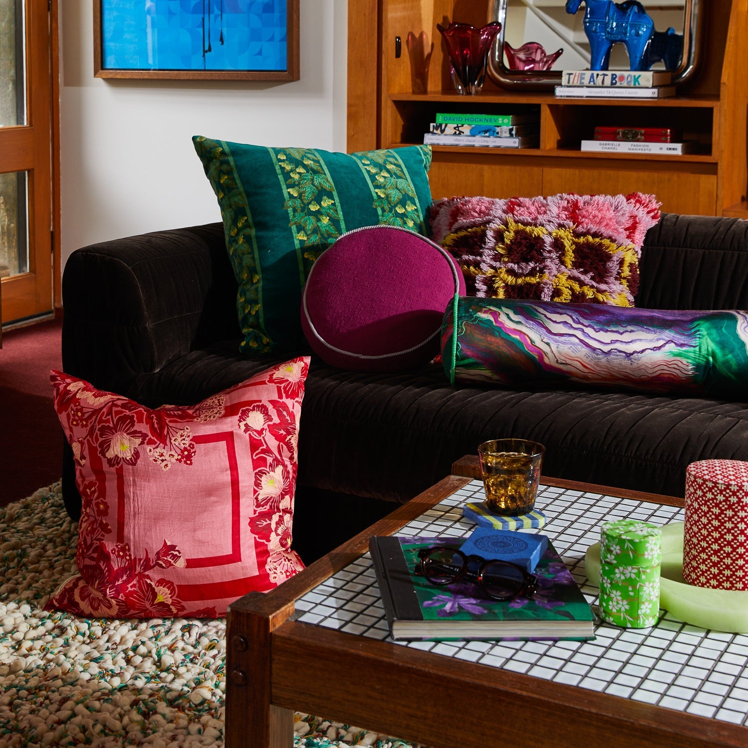 Living room styling featuring Agata Velvet Cushion with colorful throw pillows on sectional sofa