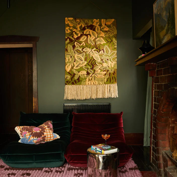 Alka Woven Wall Hanging by Sage & Clare hanging on wall