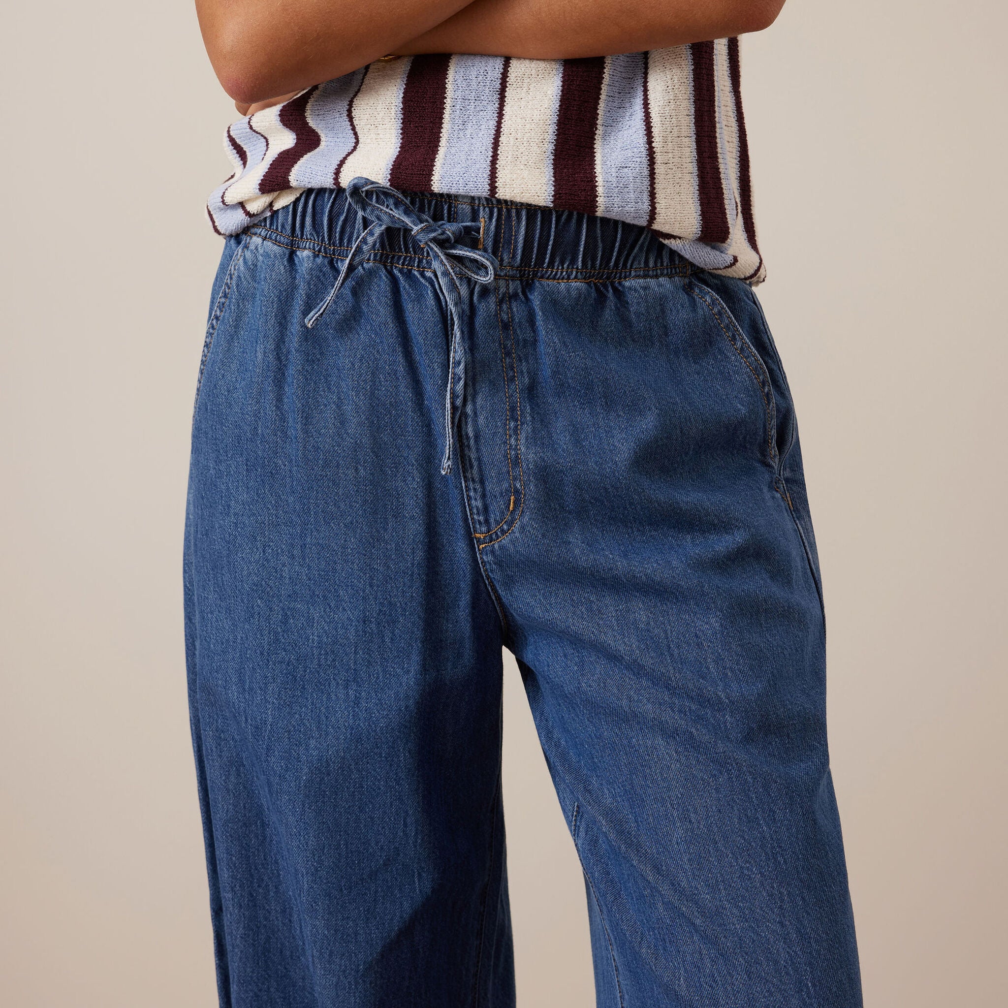 Detail of Andie Wide Leg Drawstring Pant waistband showing elastic and drawstring closure in fresh indigo