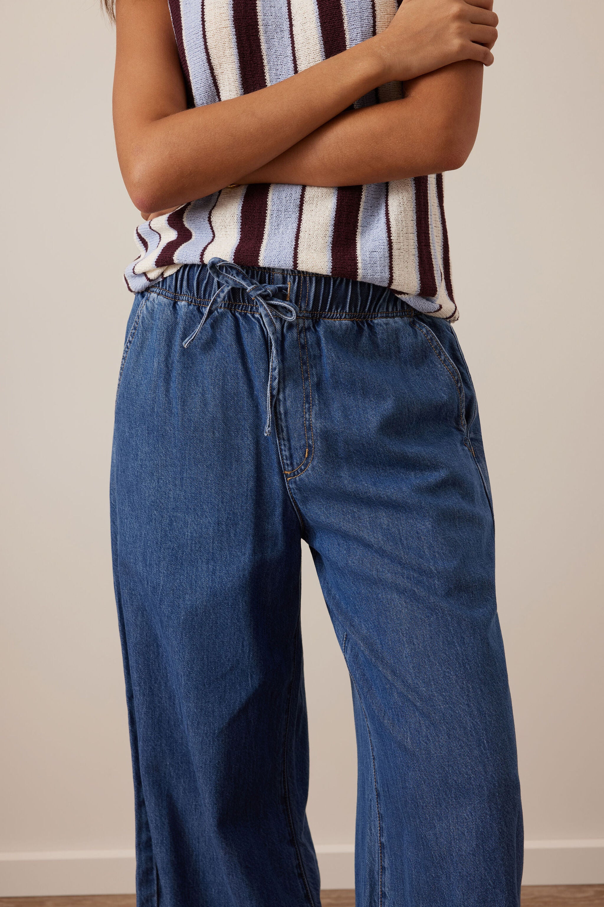 Detail of Andie Wide Leg Drawstring Pant waistband showing elastic and drawstring closure in fresh indigo