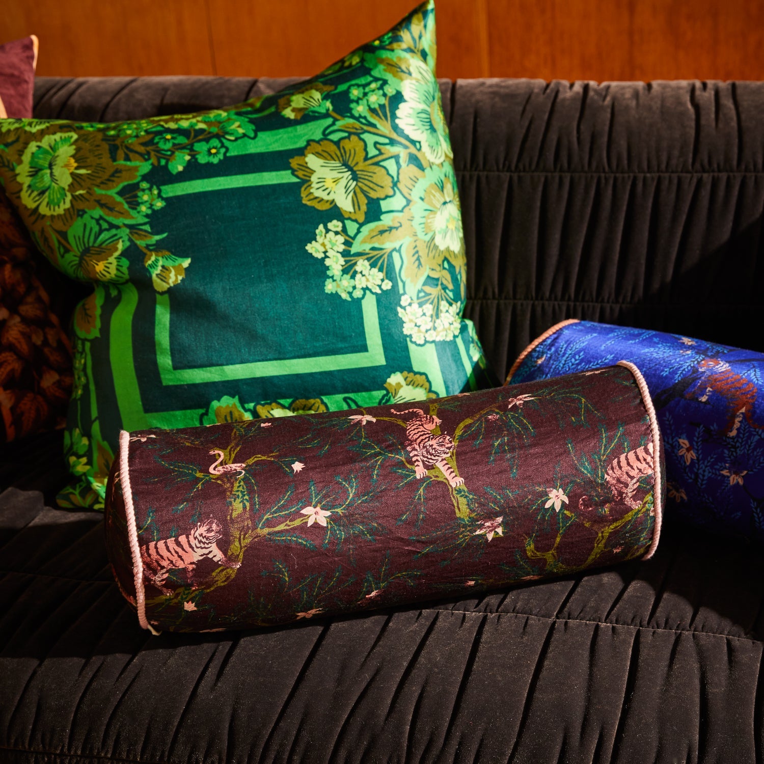 Andrea Bolster Cushion in Rosewood by Sage & Clare with tigers and jungle print on linen silk fabric