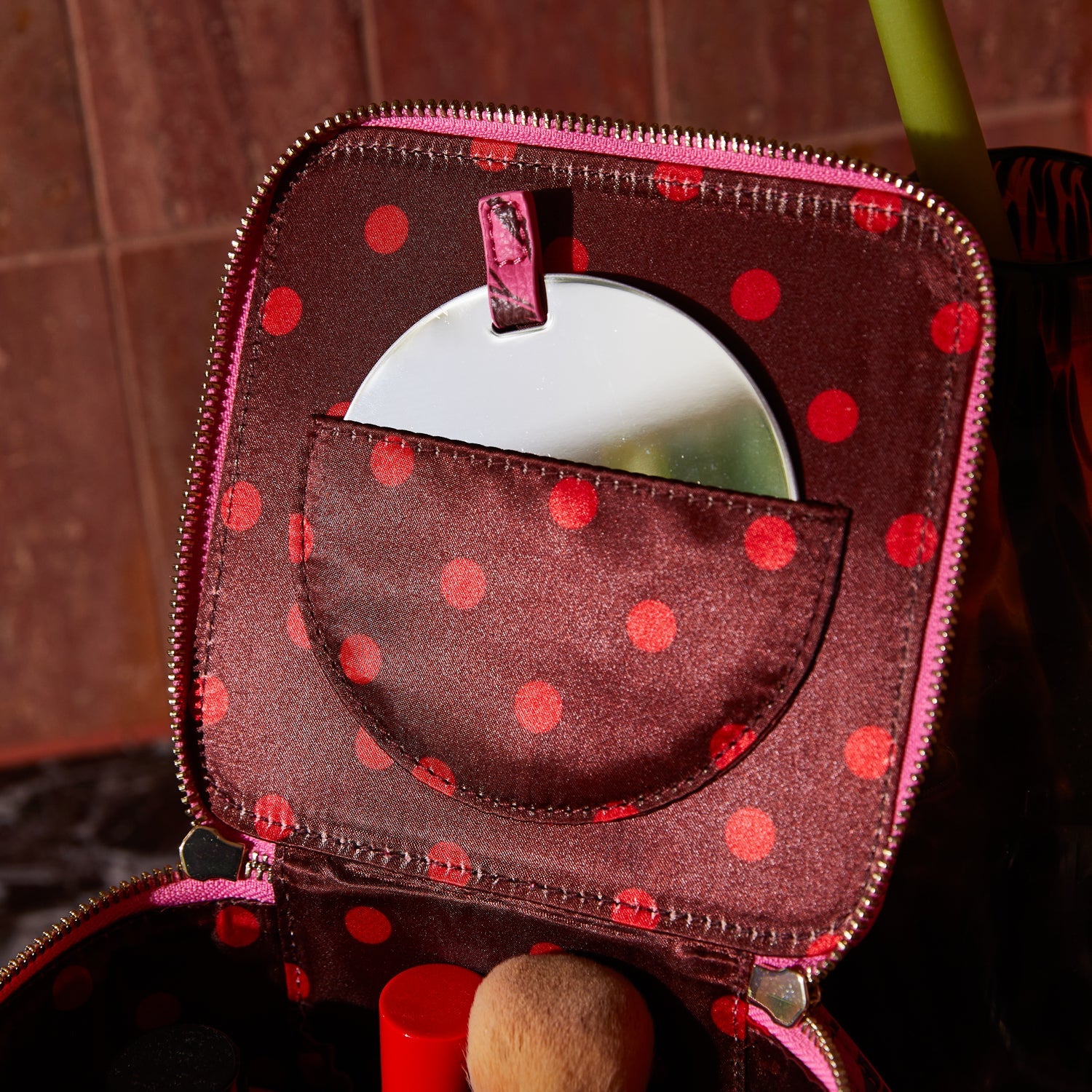 Water-resistant cosmetic case with top handle perfect for travel and daily use