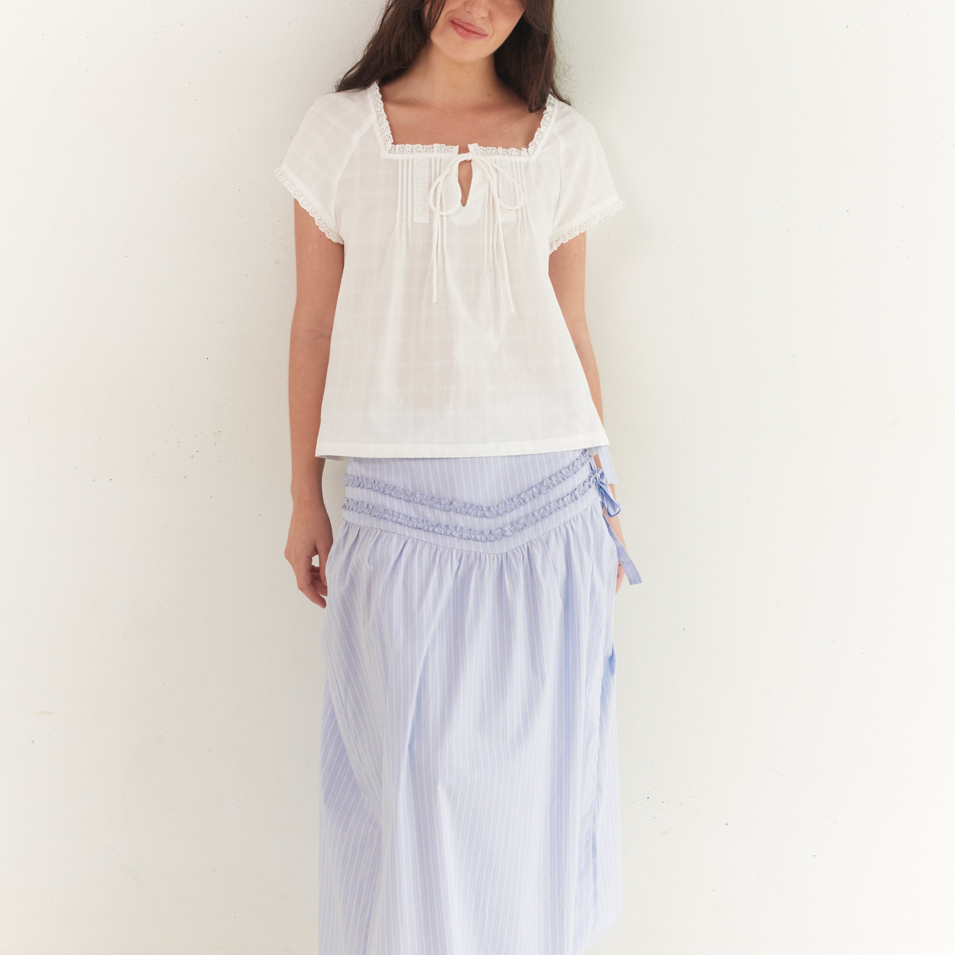 Full front view of Annika Midi Skirt in blue stripe with smocked waist detail