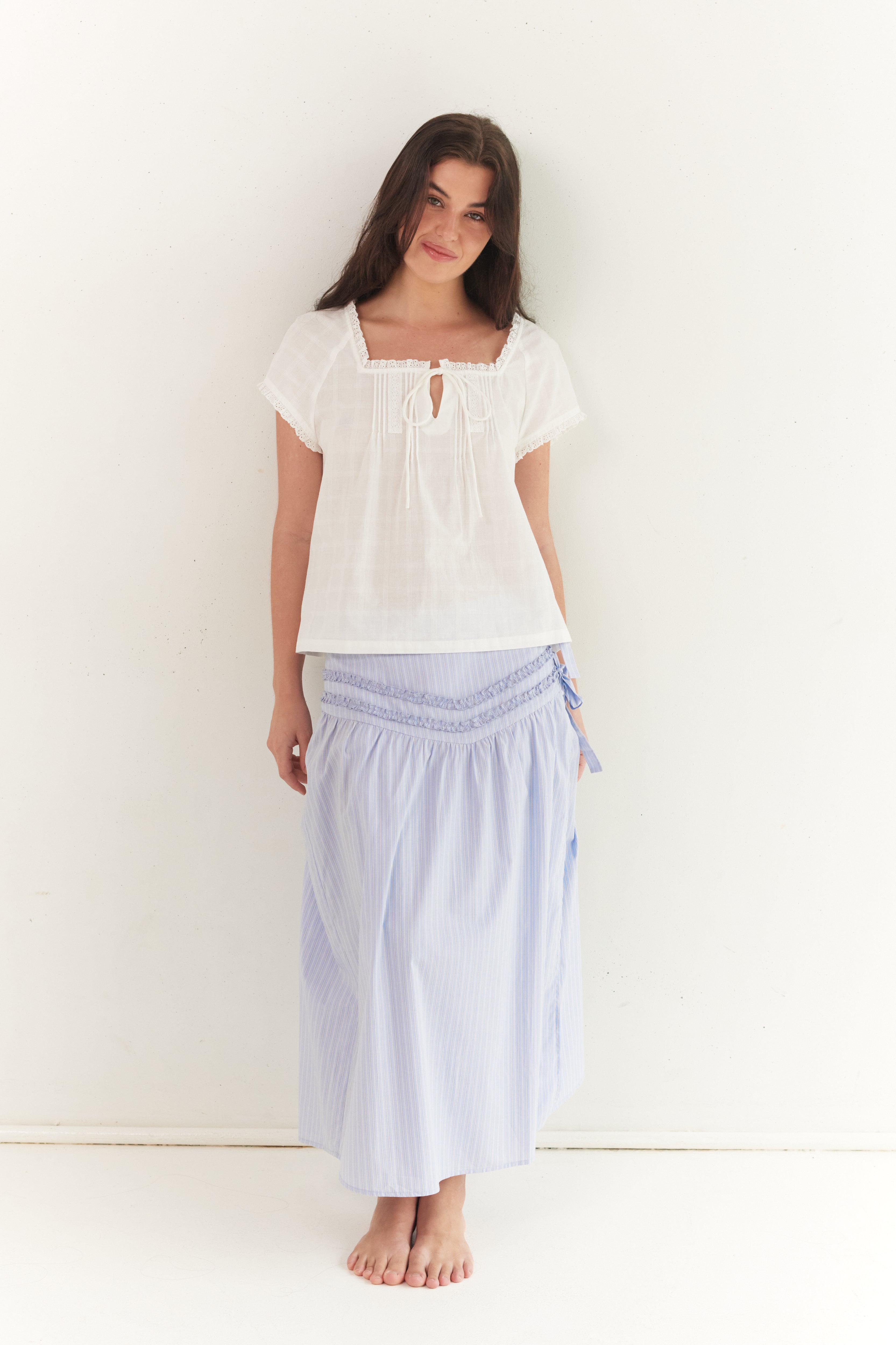 Full front view of Annika Midi Skirt in blue stripe with smocked waist detail