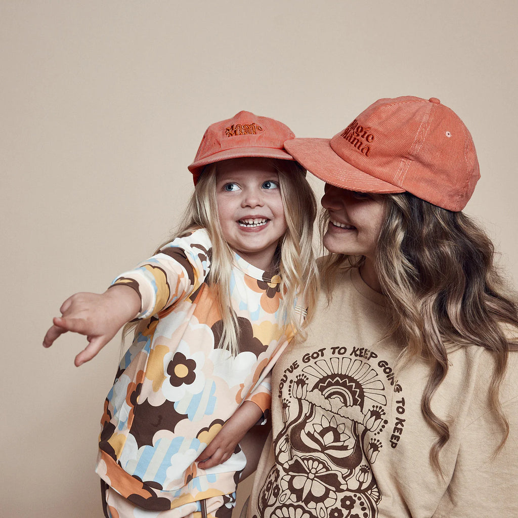 Magic mini cap worn by little girl. Her mother is wearing the Magic Mama Cord Cap by Banabae