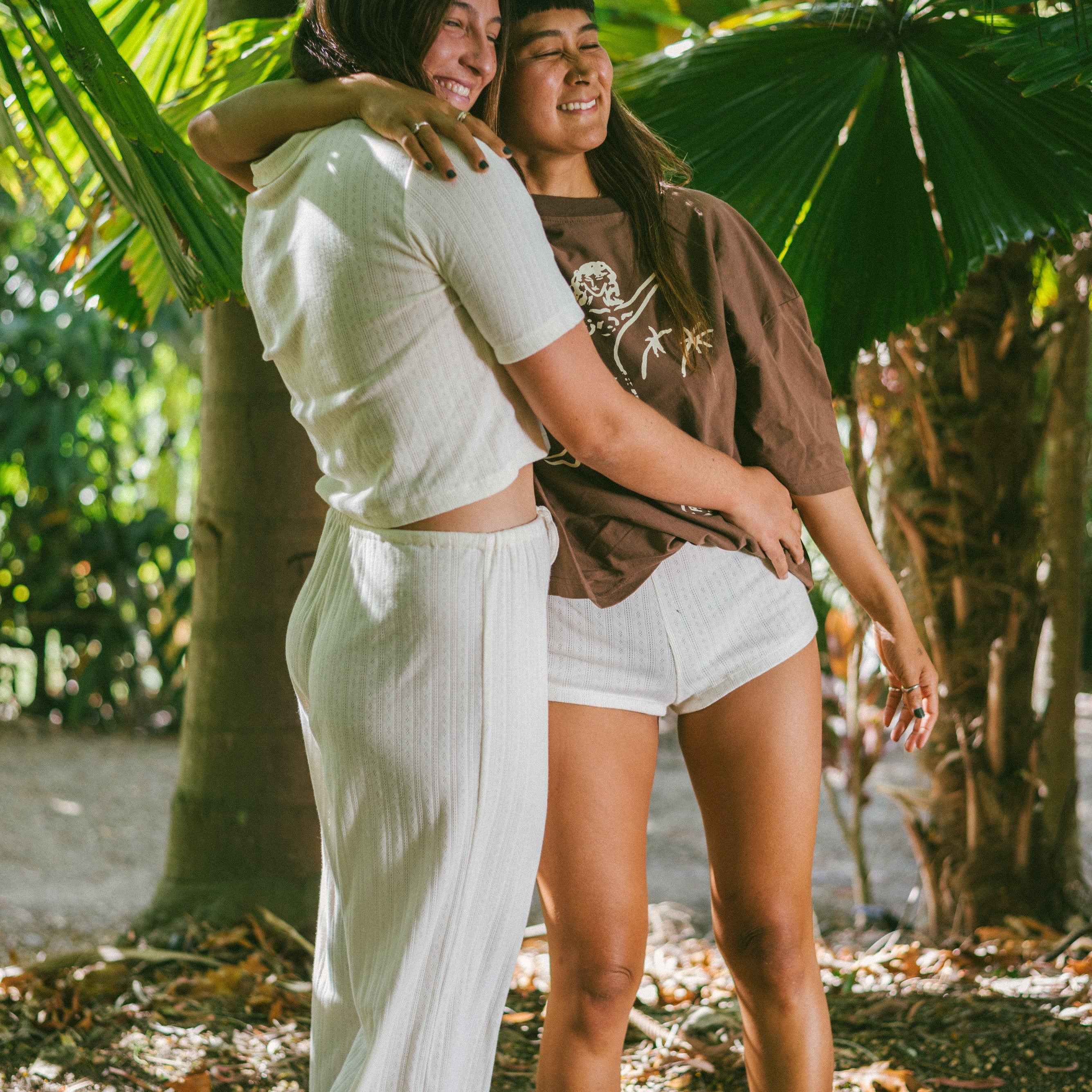 Side view of girl wearing Beach Pj Pant - Pointelle Cream | Atmosea with friend