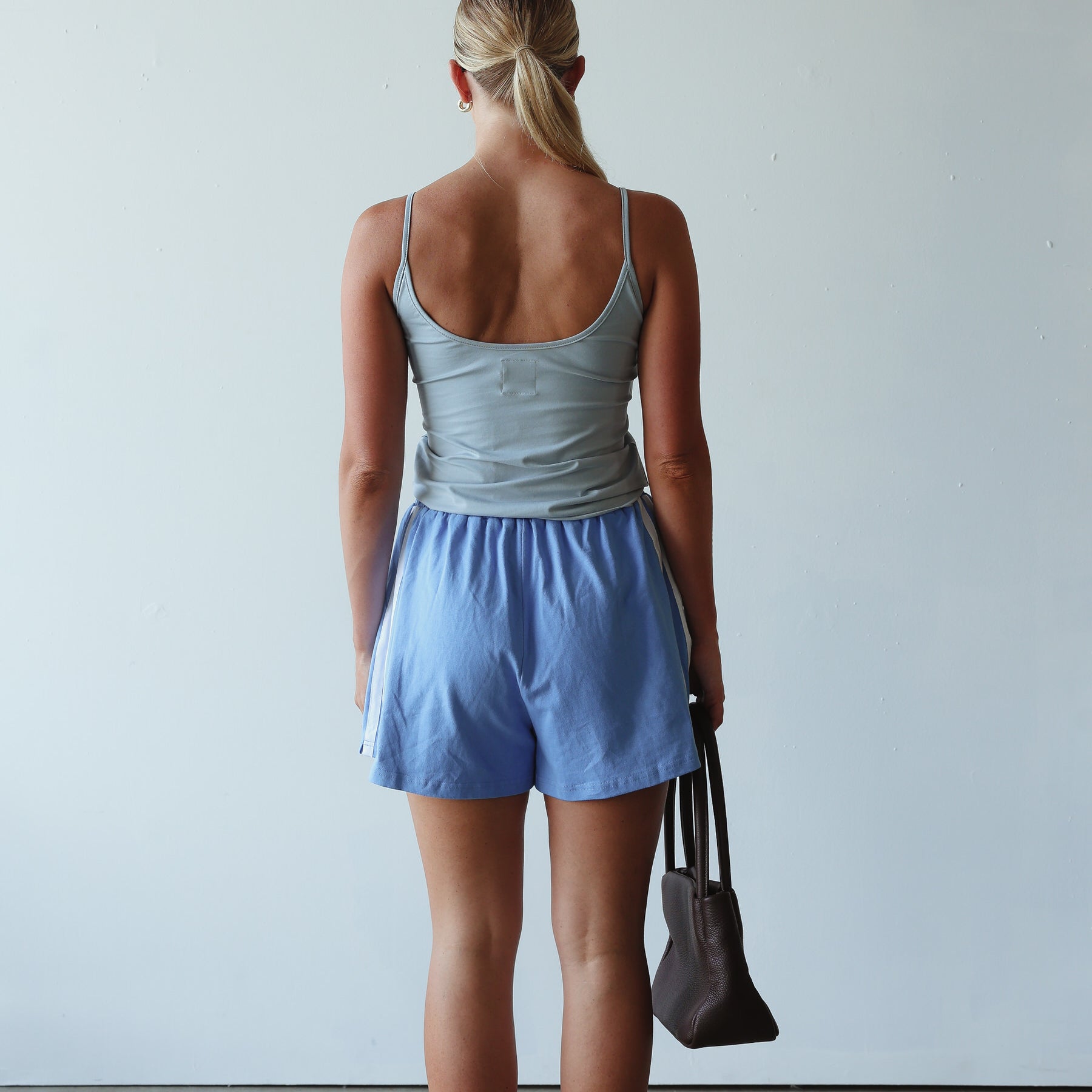 back view of model wearing Bead Tank - Cornflower by By Billie