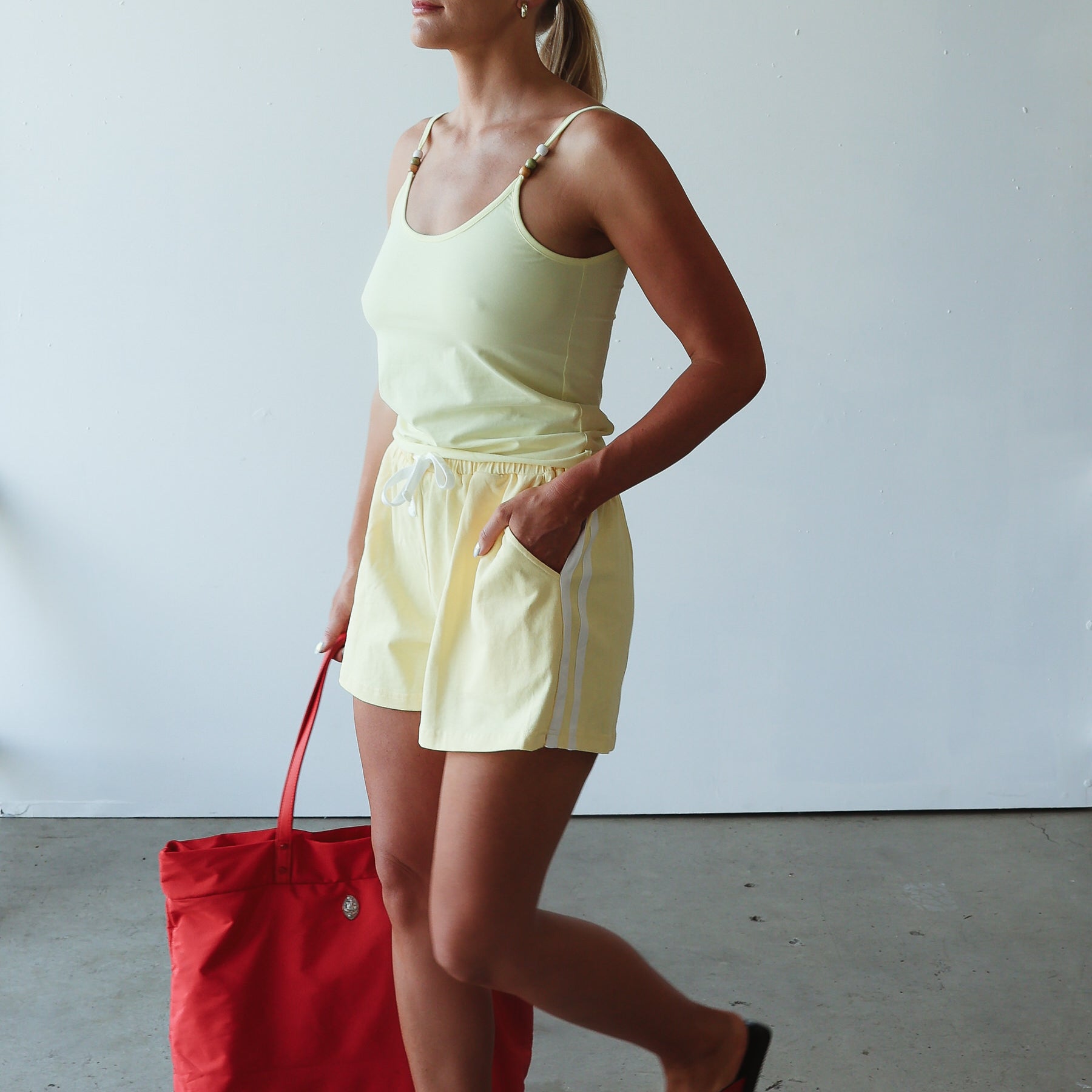 light yellow womens singlet and shorts made from cotton