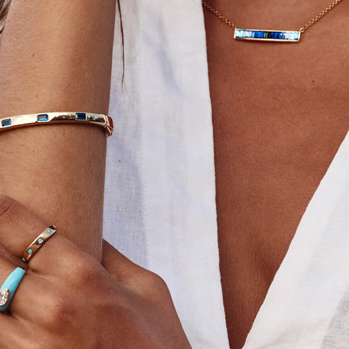 gold necklace with blue stones