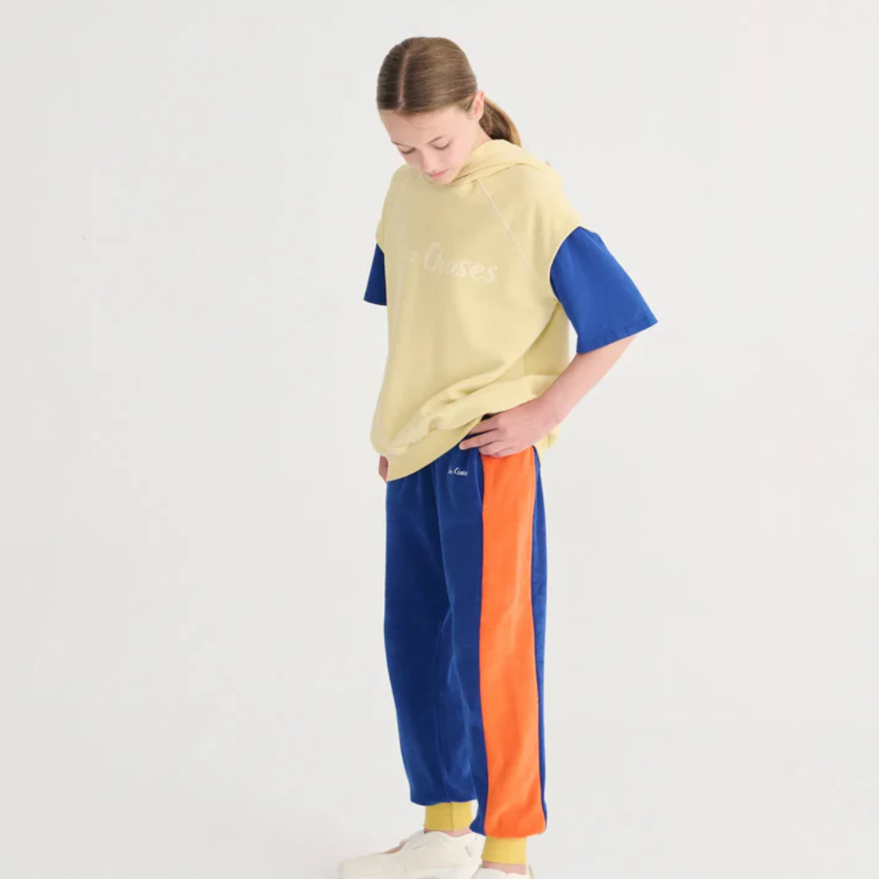 Side angle of girl wearing Bobo Choses Sleeveless Hoodie - Yellow | Bobo Choses