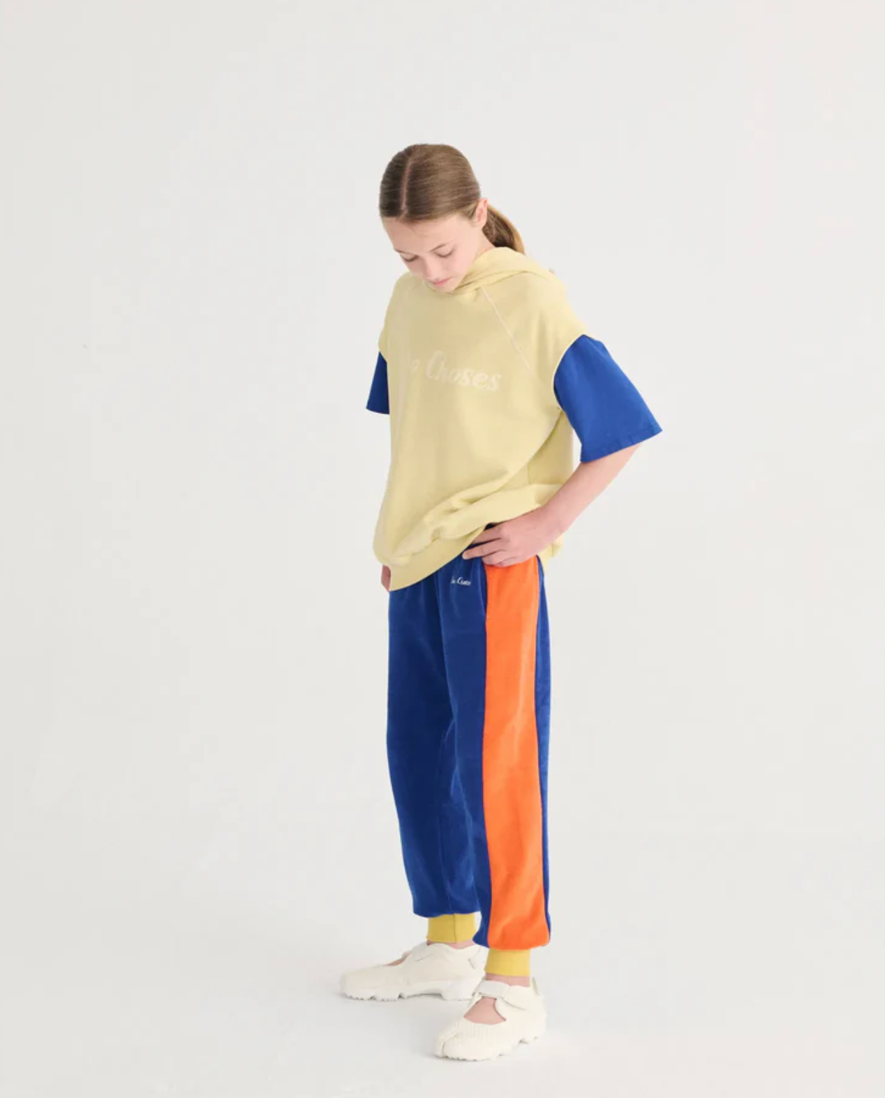 Side angle of girl wearing Bobo Choses Sleeveless Hoodie - Yellow | Bobo Choses