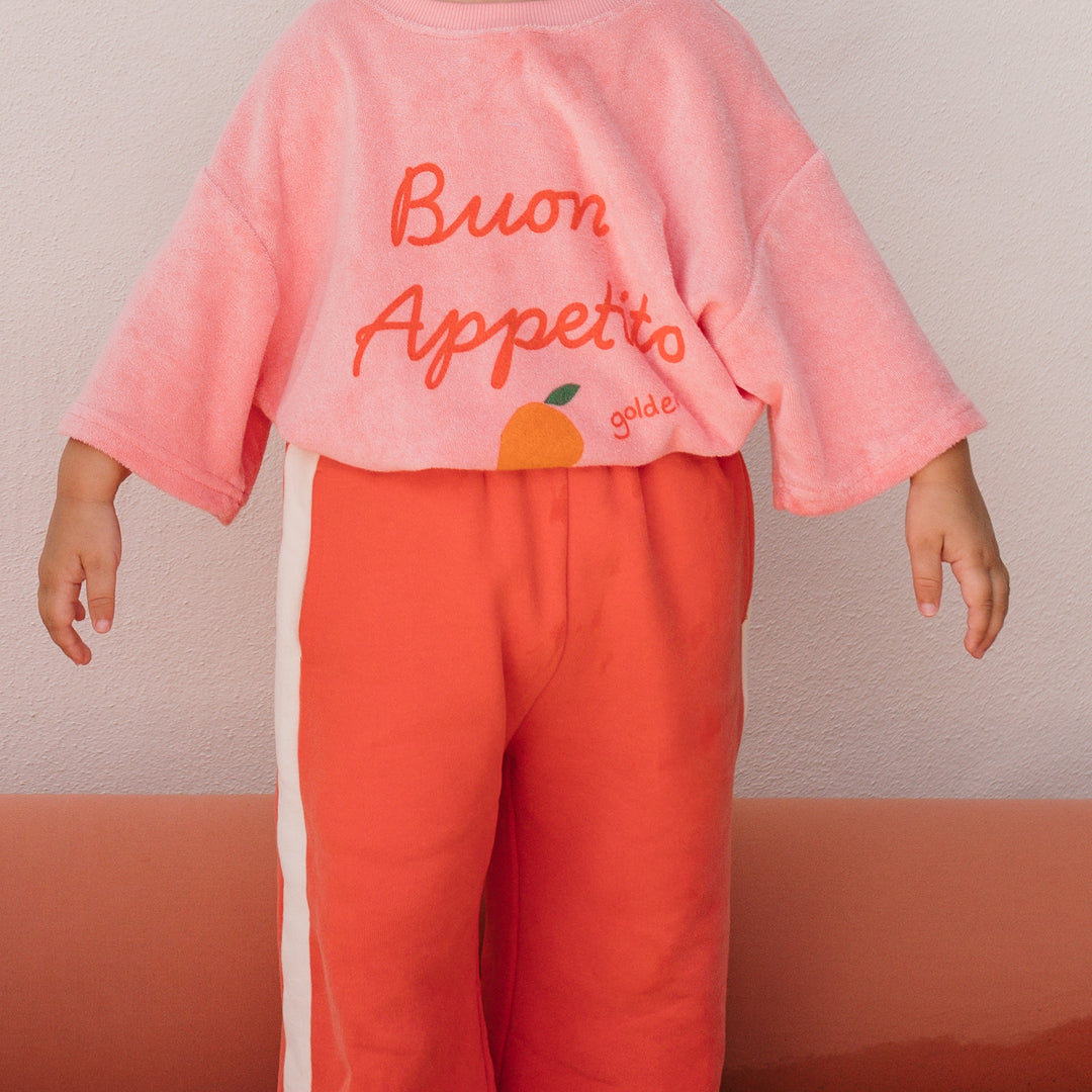Girl in the Buon Appetito T-shirt - Pink Icing | Golden Children