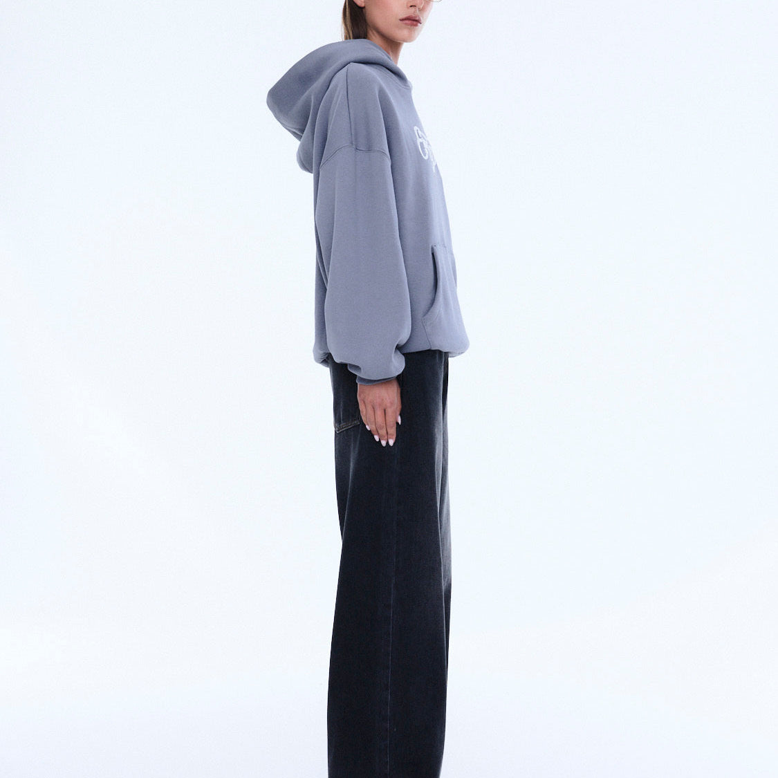 Side view of gray Cassie Oversized Hoodie showing relaxed fit and oversized silhouette
