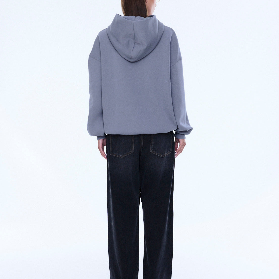 Back view of Cassie Oversized Hoodie displaying gray color and hood construction