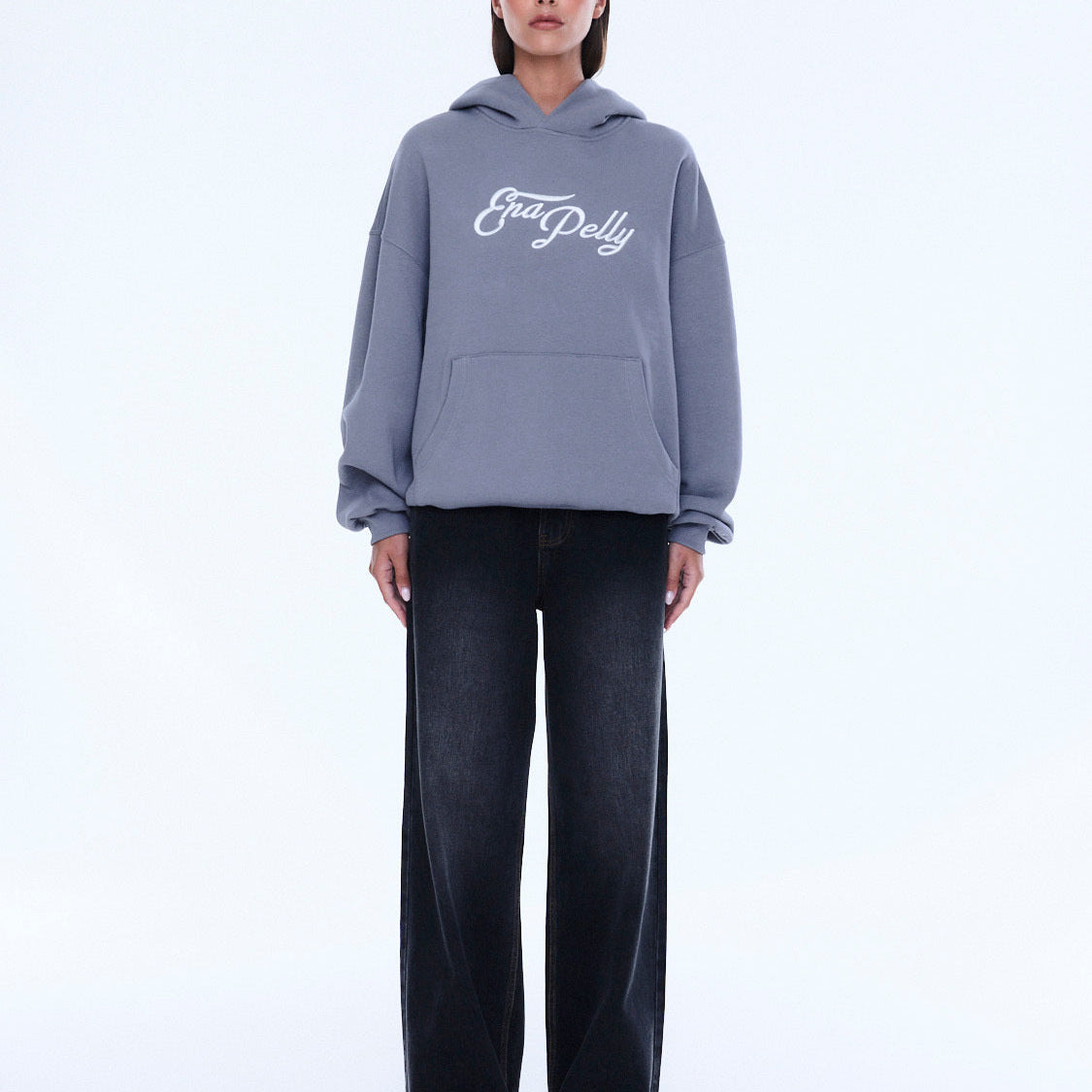 Front view of gray Cassie Oversized Hoodie with white script logo and hood styling