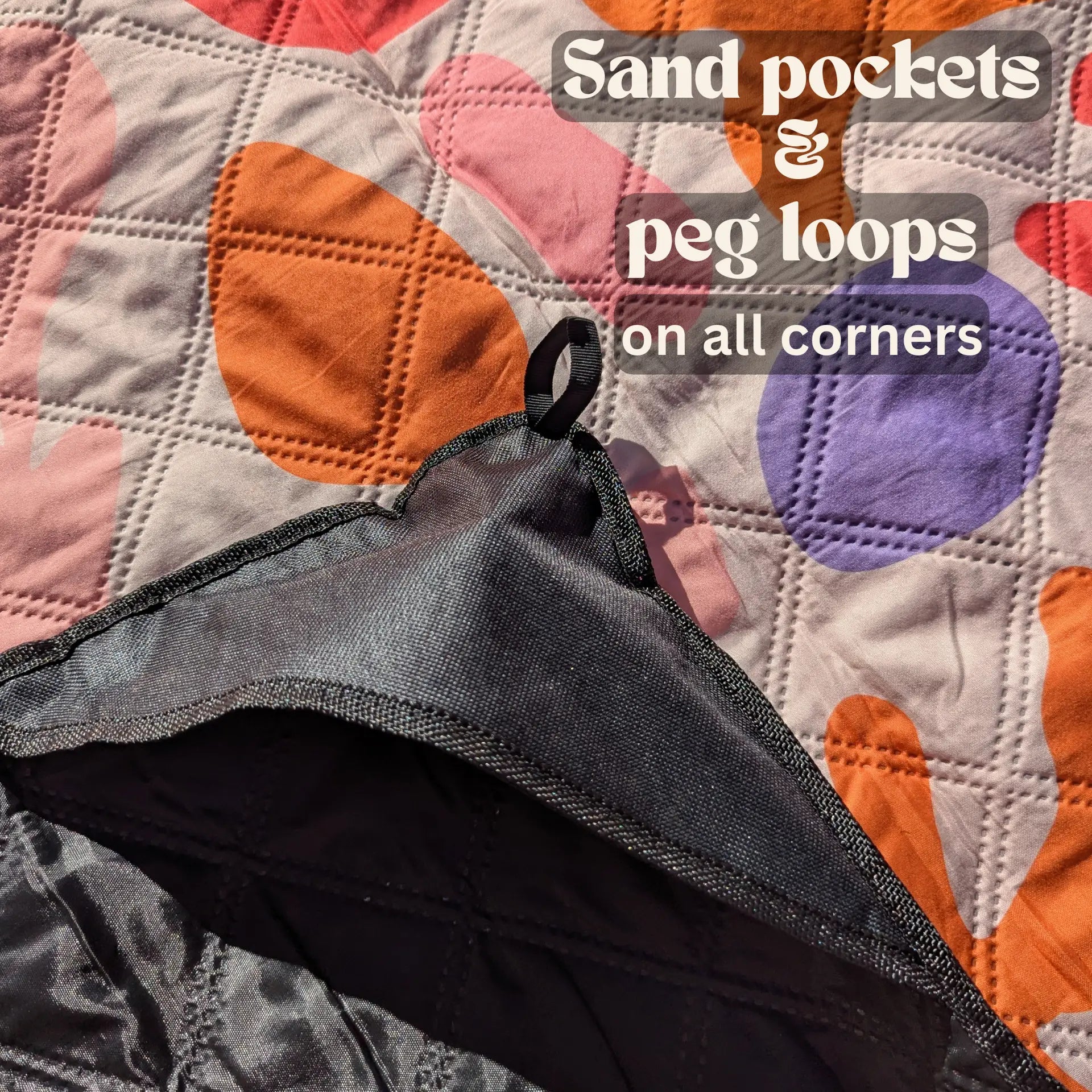 Cool cabana beach mat with sand pockets and peg loops