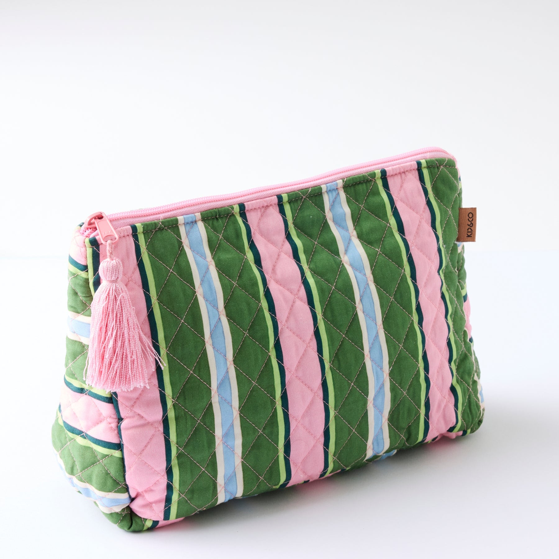 Side angle view of Cactus Stripe Quilted Cotton Toiletry Purse showing quilted texture and pink zipper closure