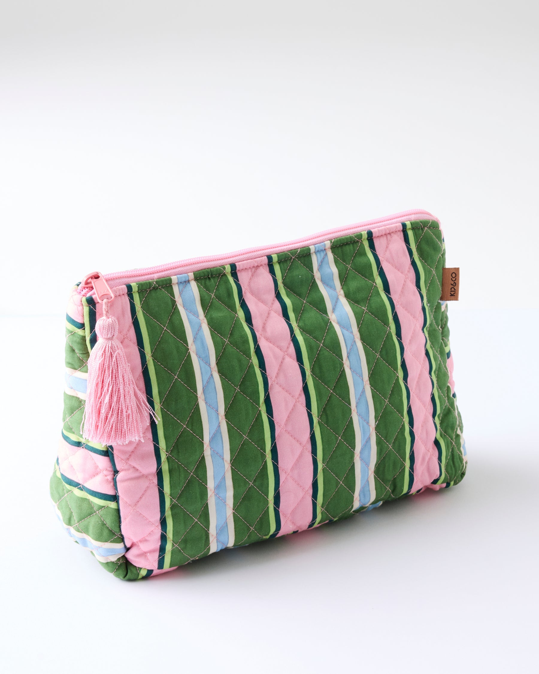 Side angle view of Cactus Stripe Quilted Cotton Toiletry Purse showing quilted texture and pink zipper closure