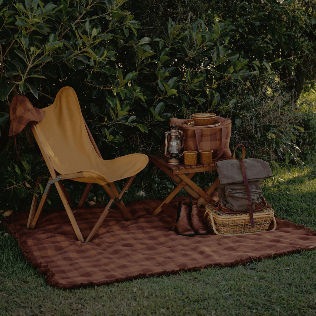 Outdoor camping setup with Camp Picnic Rug by Wandering Folk featuring waterproof design and fringe trim