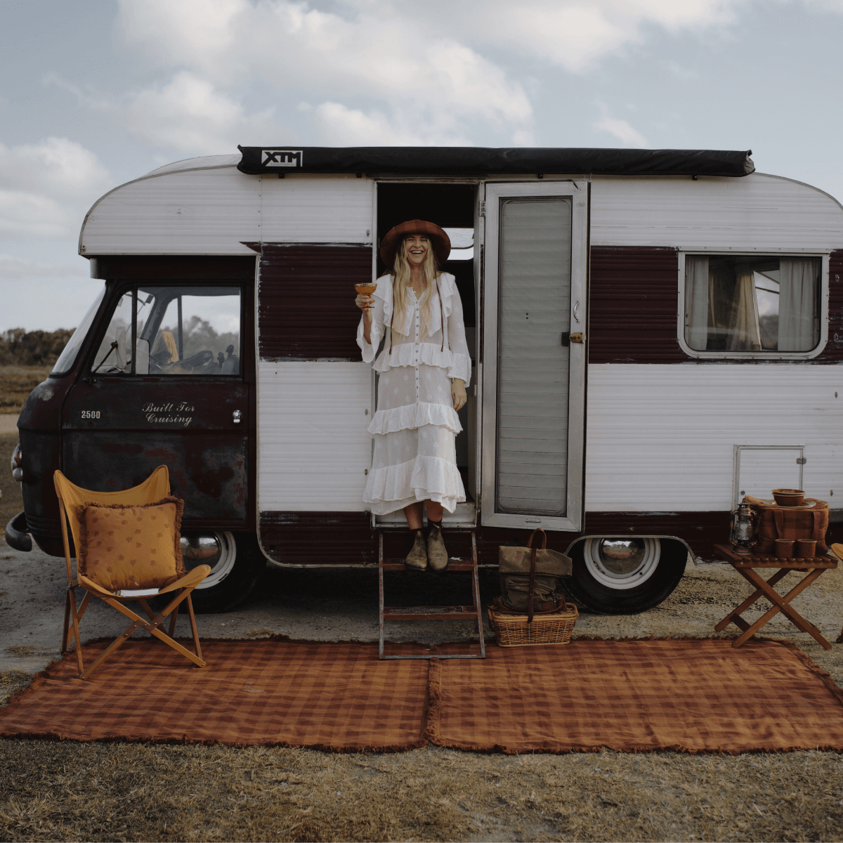 Woman standing on Camp Picnic Rug by Wandering Folk at vintage caravan showing 164cm x 147cm size