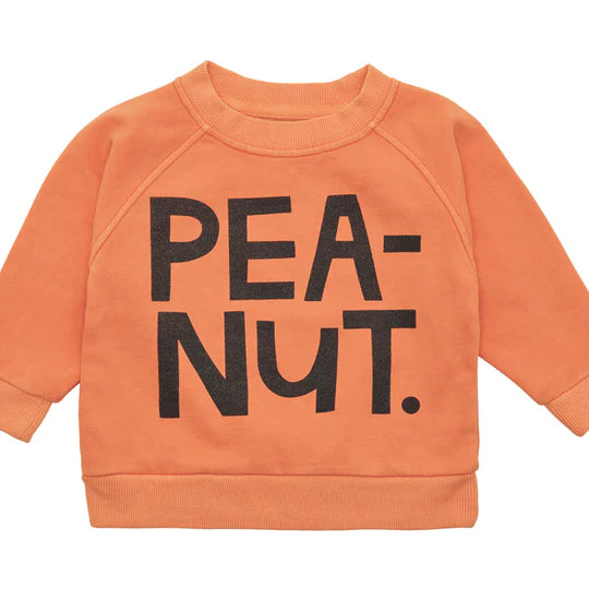 Tangerine cotton fleece sweater with black text that says PEANUT