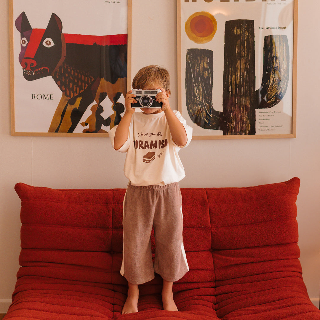 Young boy wearing the Ciao Tutti Pants- Coffee / Buttercream | Golden Children