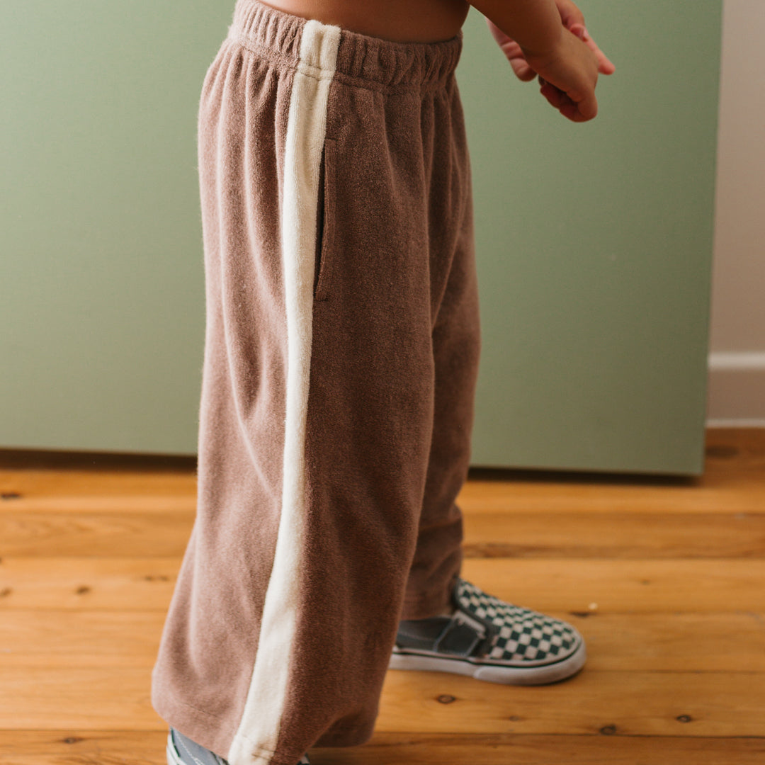 Side view of boy in the Ciao Tutti Pants- Coffee / Buttercream | Golden Children