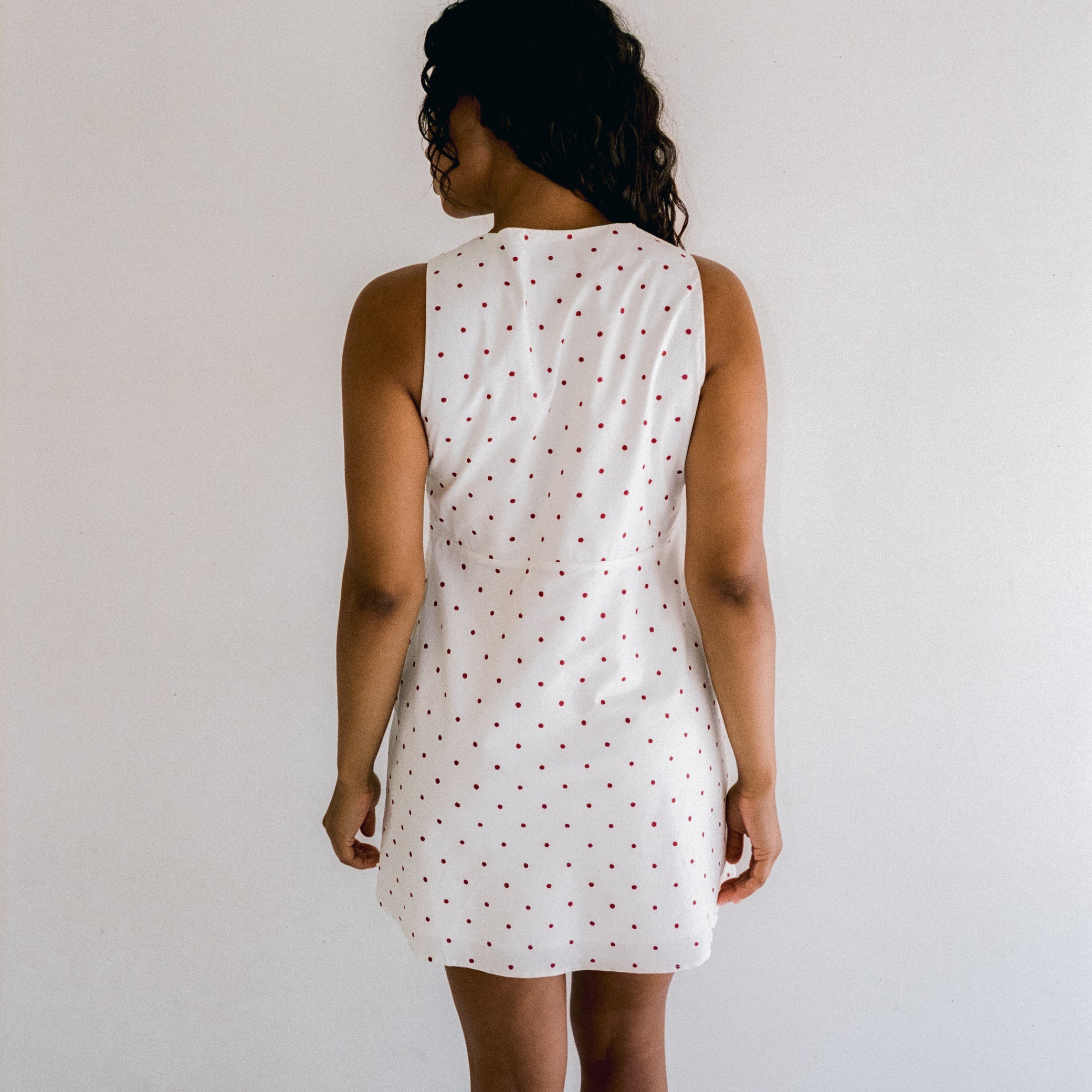 back view of Clara Mini Dress – Cherry Polka Dot by Juni