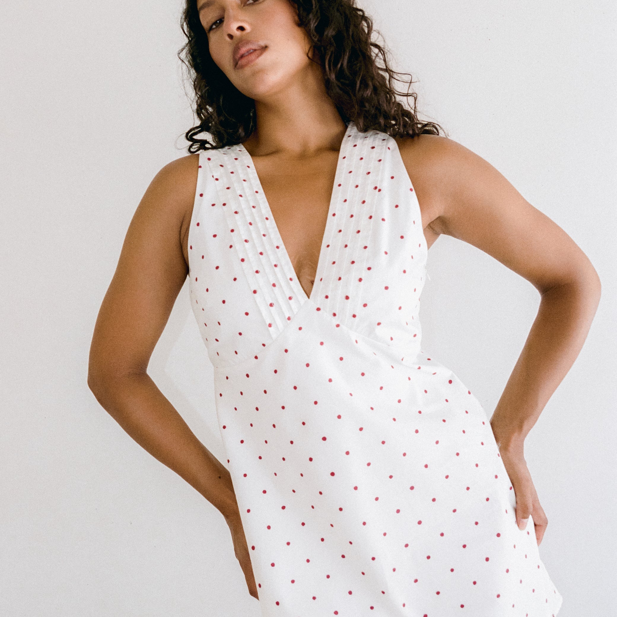 white mini dress with red polka dots by Juni