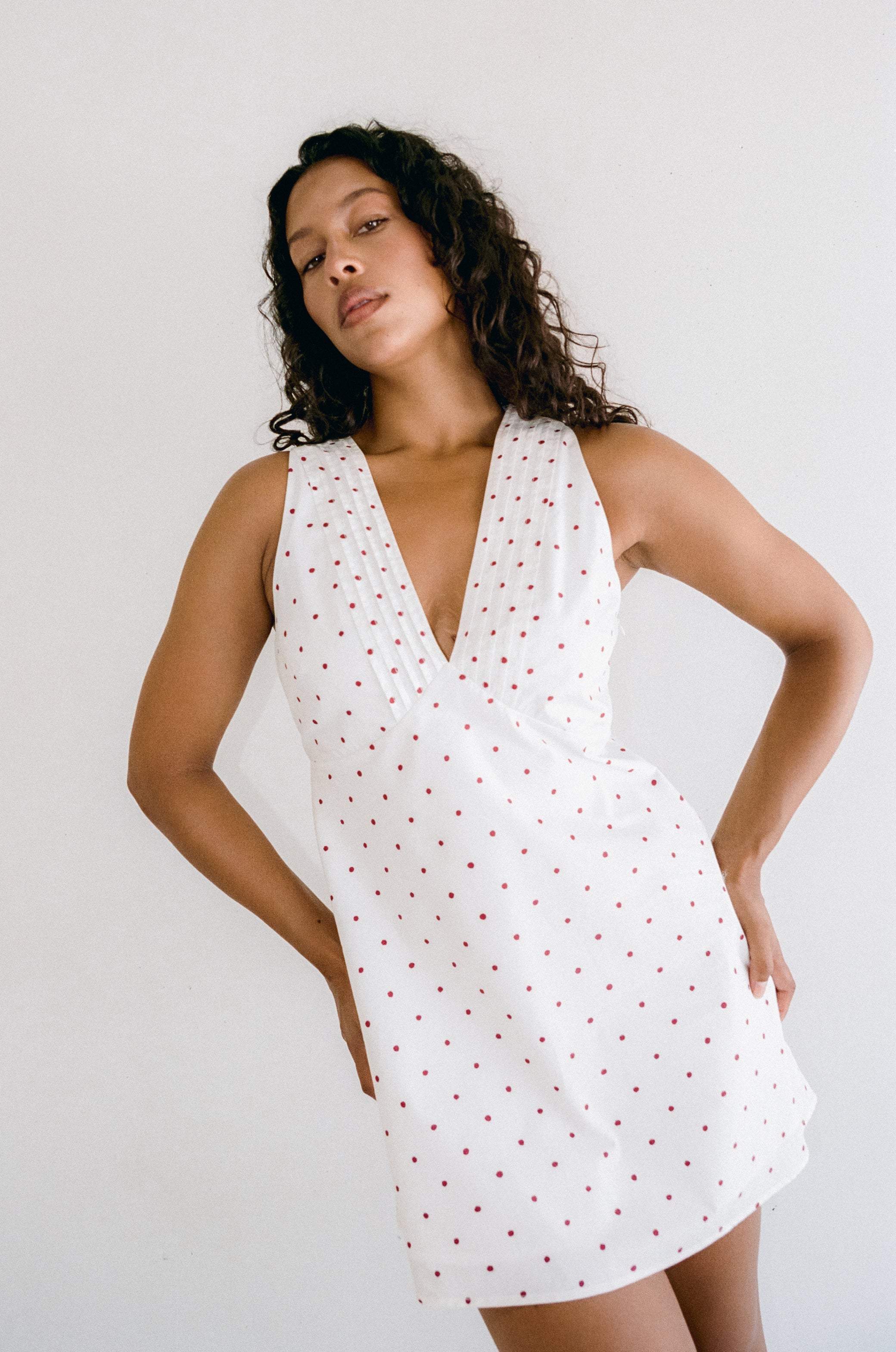white mini dress with red polka dots by Juni