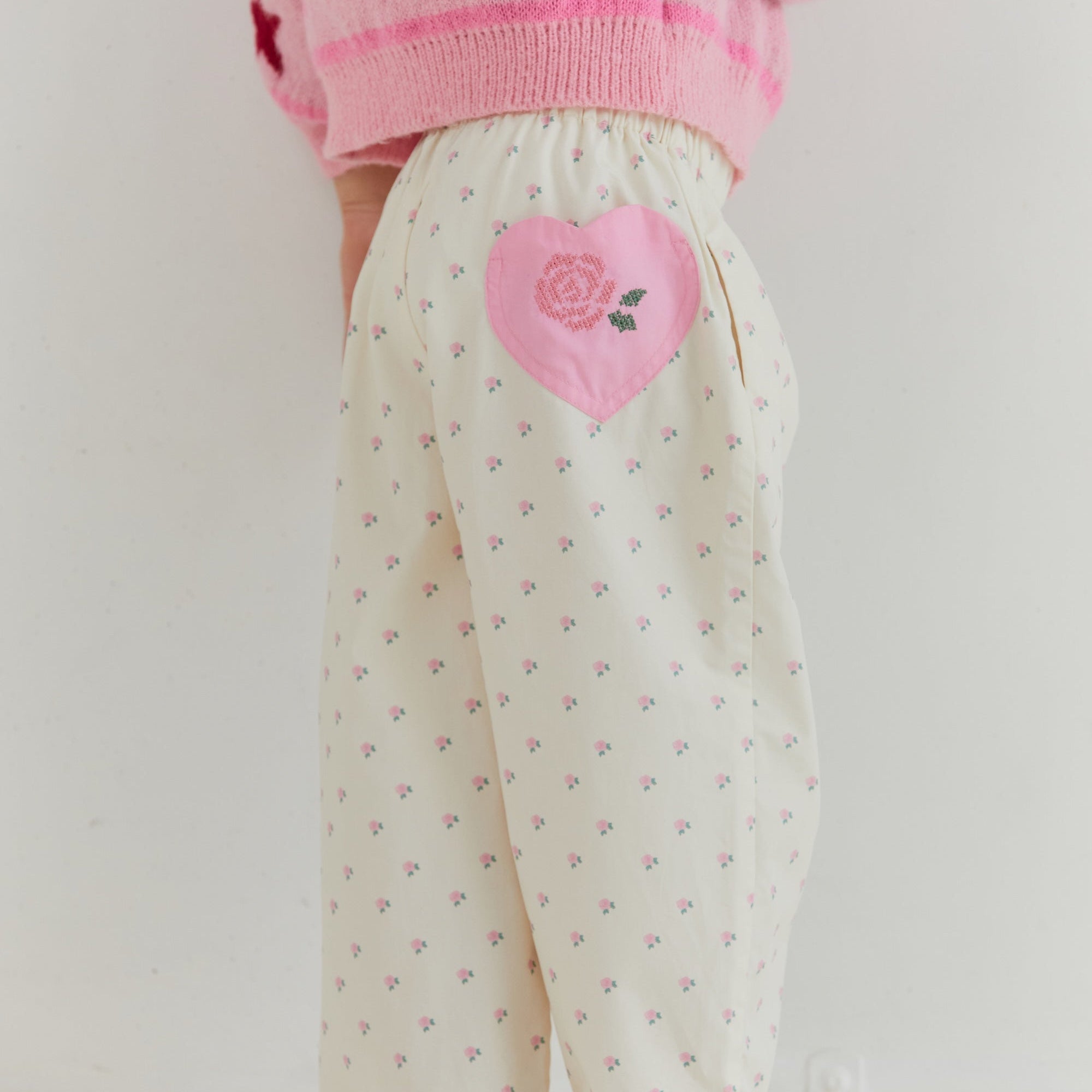 Back view detail of Cleo Pant showing pink heart patch and elastic waistband