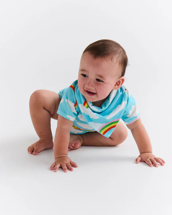 Baby wearing Cloudy Dayz romper crawling on floor – showcasing short sleeves, breathable cotton fabric, and cheerful design