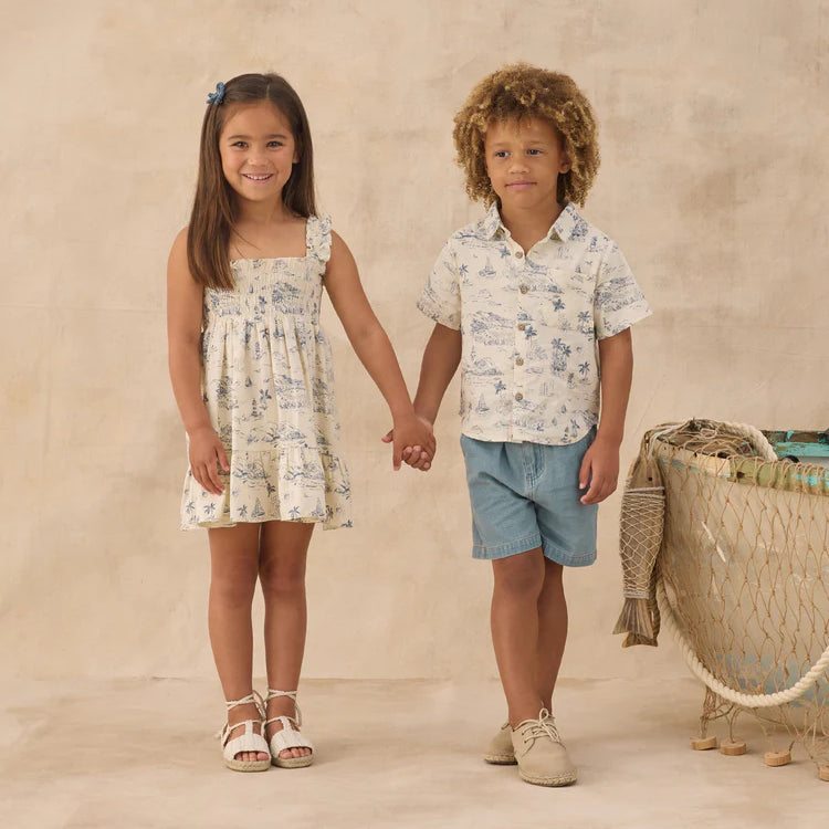 Boy and girl wearing clothing with the ocean toile print