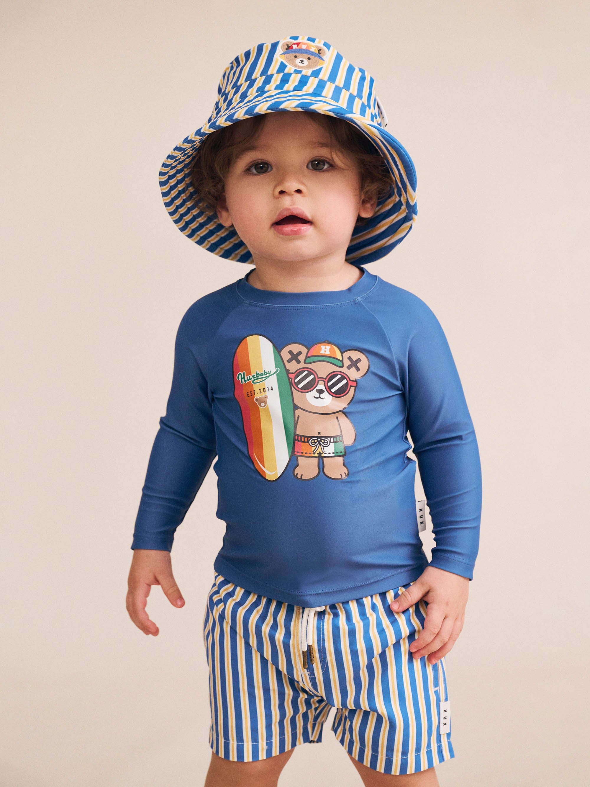 Boy wearing the Collegiate Stripe Boardshort | Huxbaby