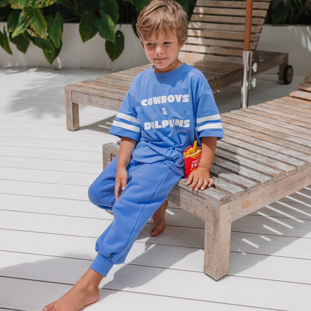 Young boy in the Cowboys & Dolphins T-shirt - Pool Blue | Golden Children