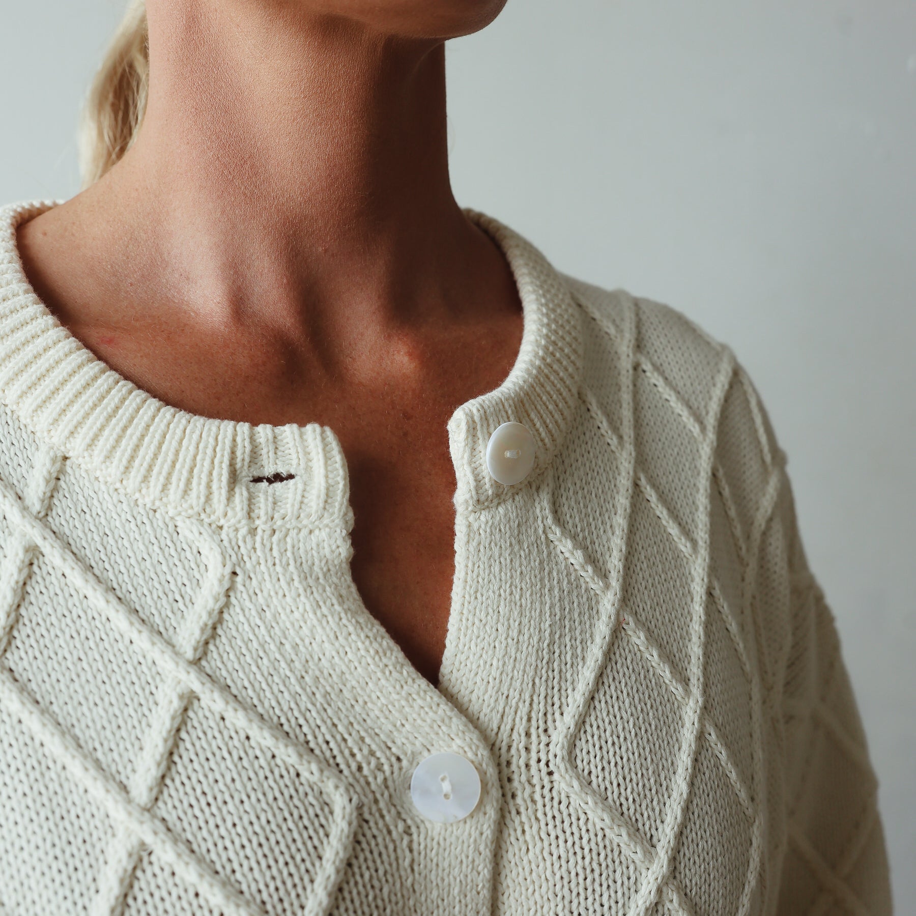 neckline details of Crochet Knit Cardigan - cream by By Billie