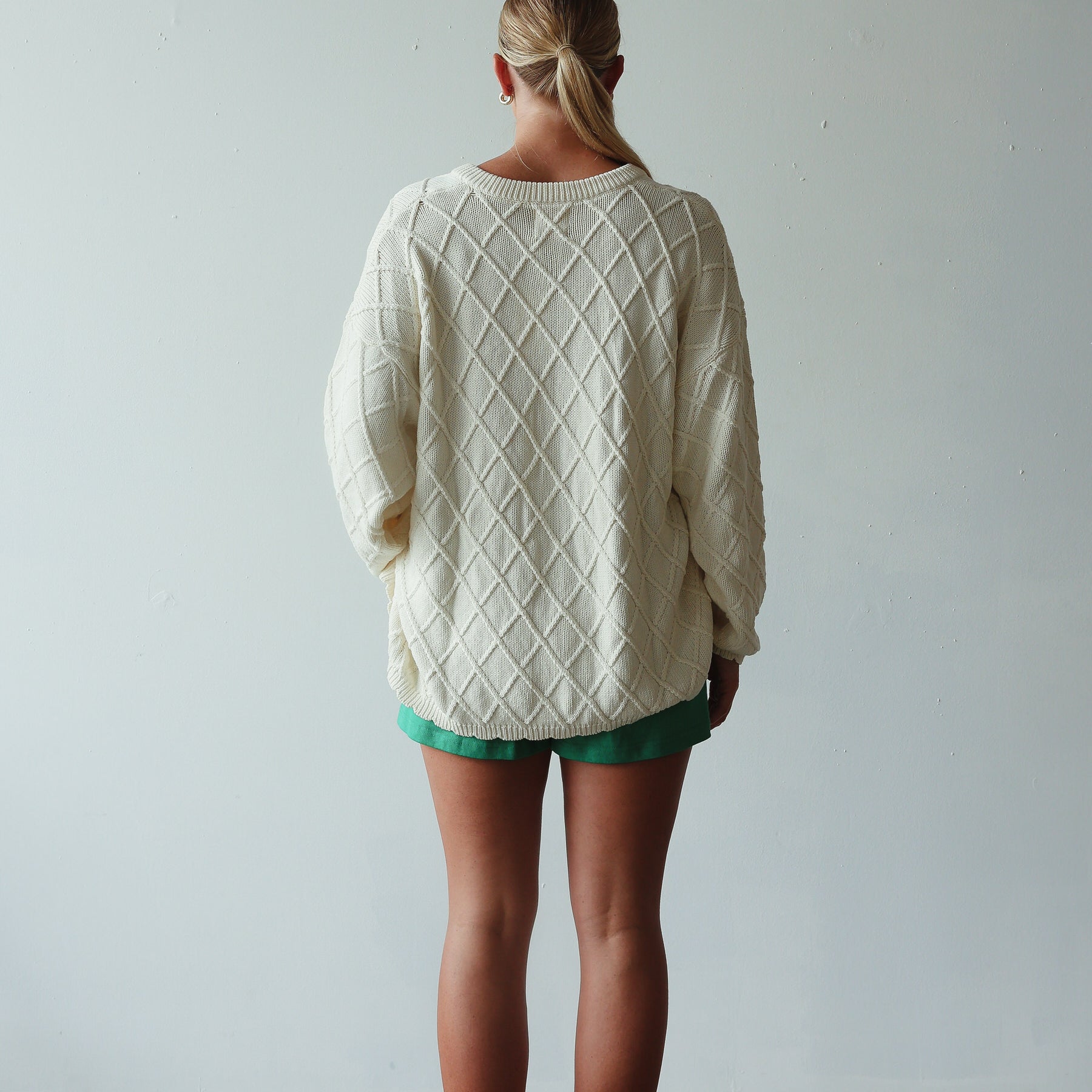 back view of model wearing Crochet Knit Cardigan - cream by By Billie