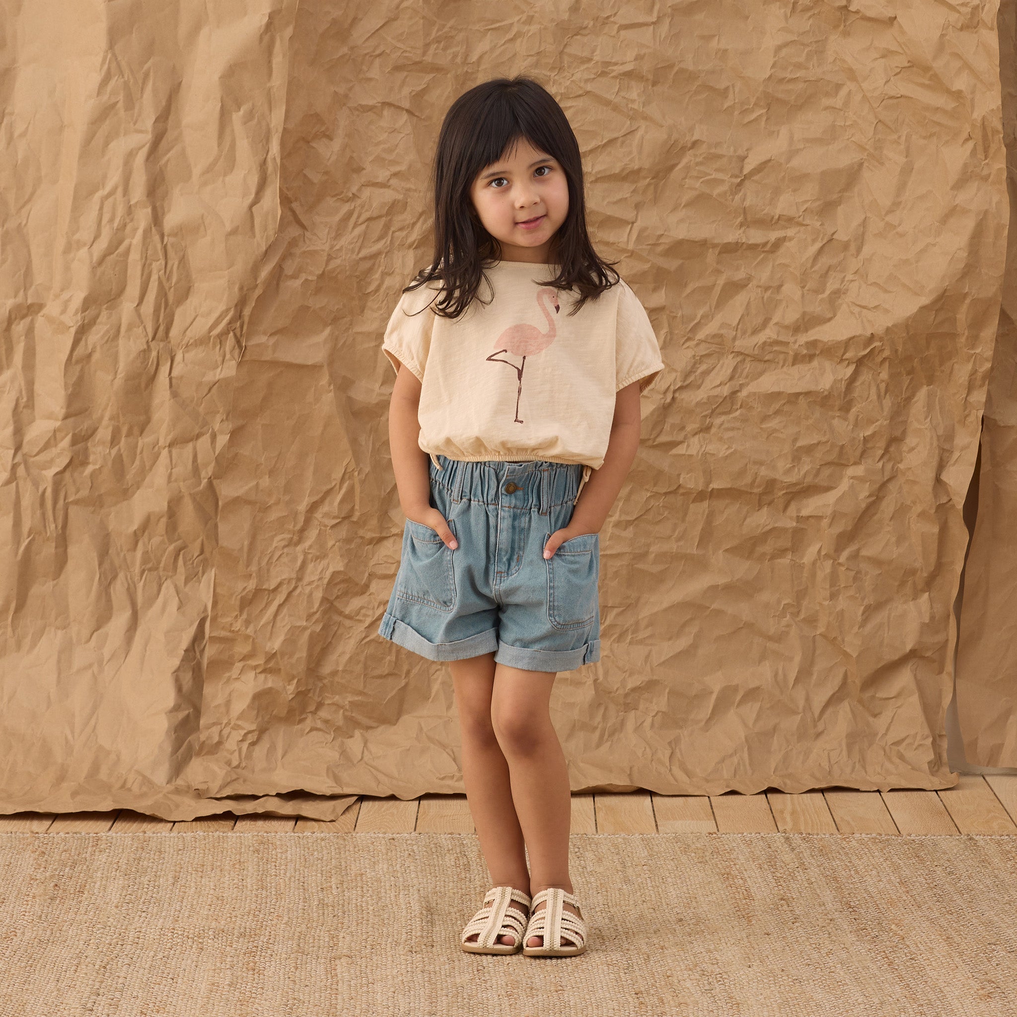 Front view of young girl in the Cropped Cinch Tee Flamingo | Rylee +Cru