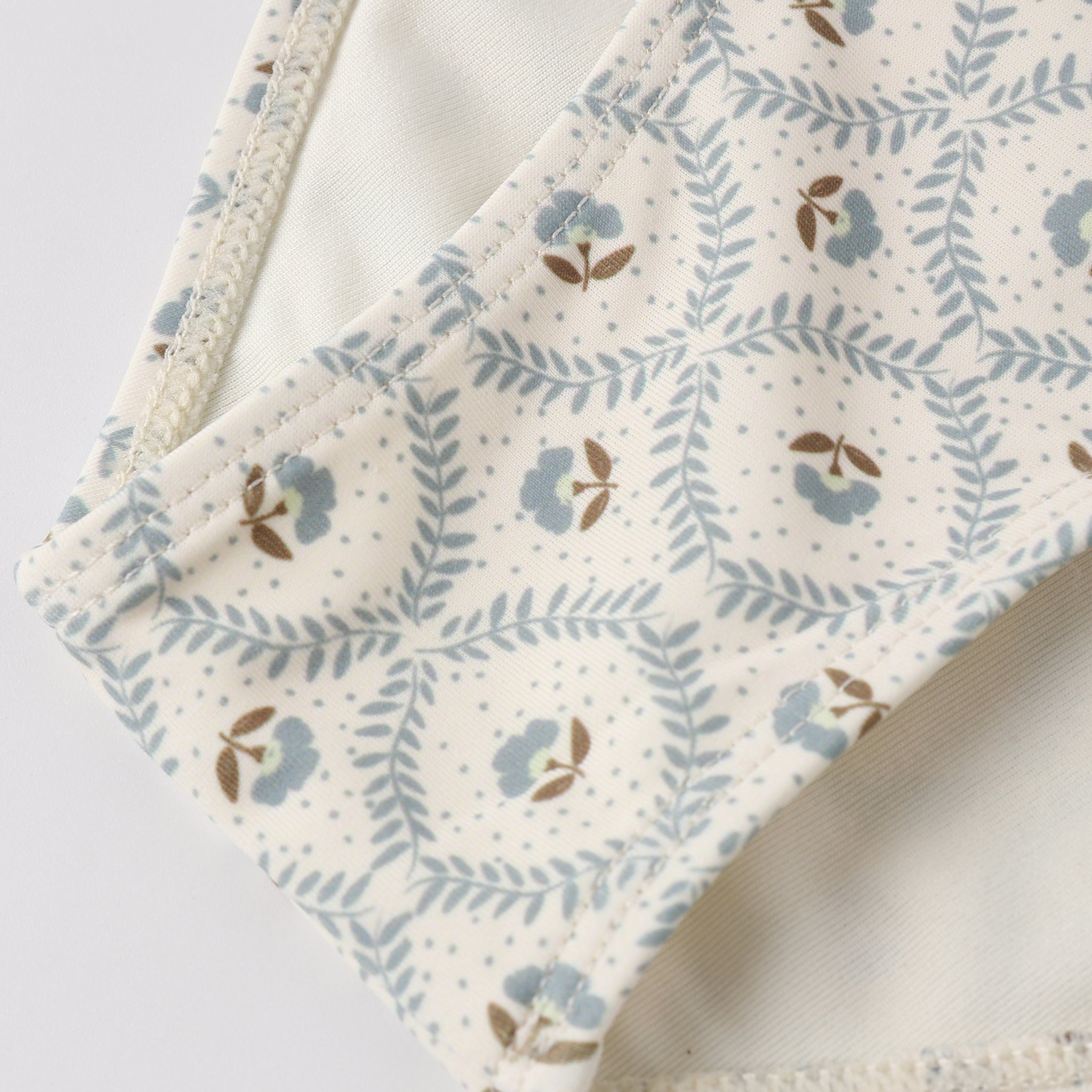 Close up of pattern on the Cropped Rashguard Set Green Fleur | Rylee + Cru
