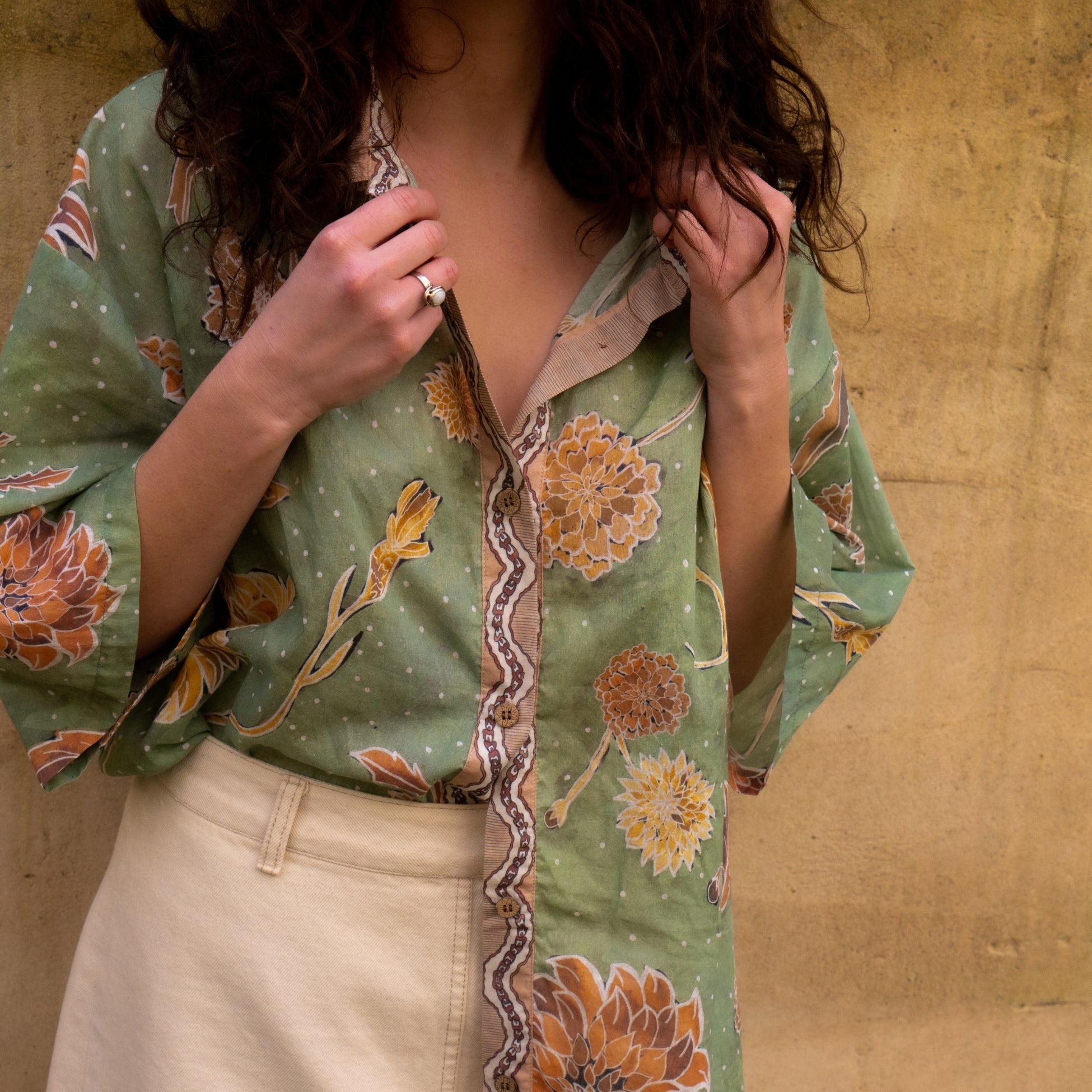 Close-up detail of Dahlia shirt contrast placket with vintage chain-inspired watercolor motif