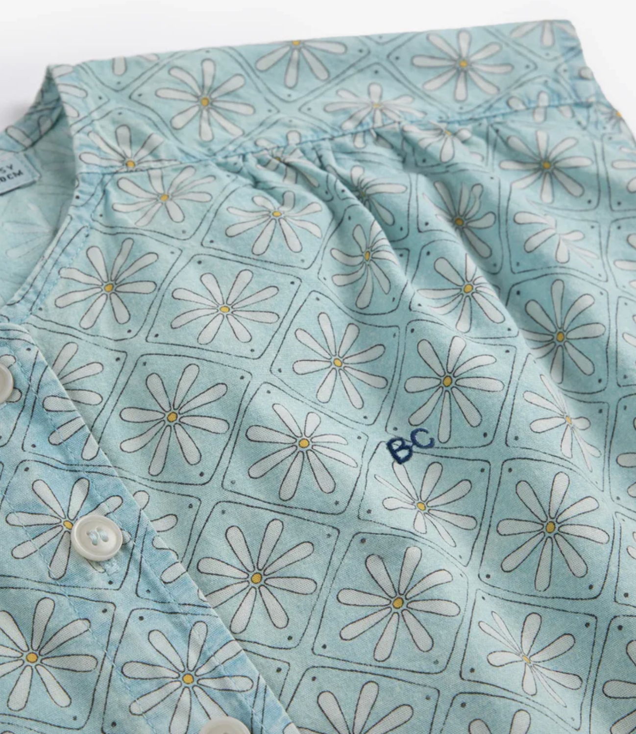 Close up of the Daisy Mosaic All Over Woven Top - Light Blue | Bobo Choses