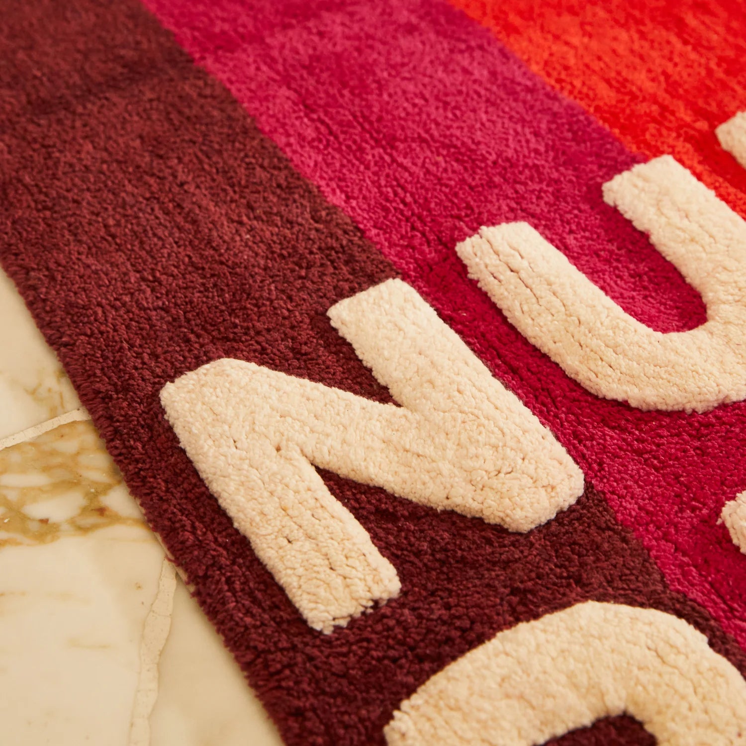 Nudie Rudie detail of Dariel Nudie Bath Mat – Scarlet by Sage & Clare