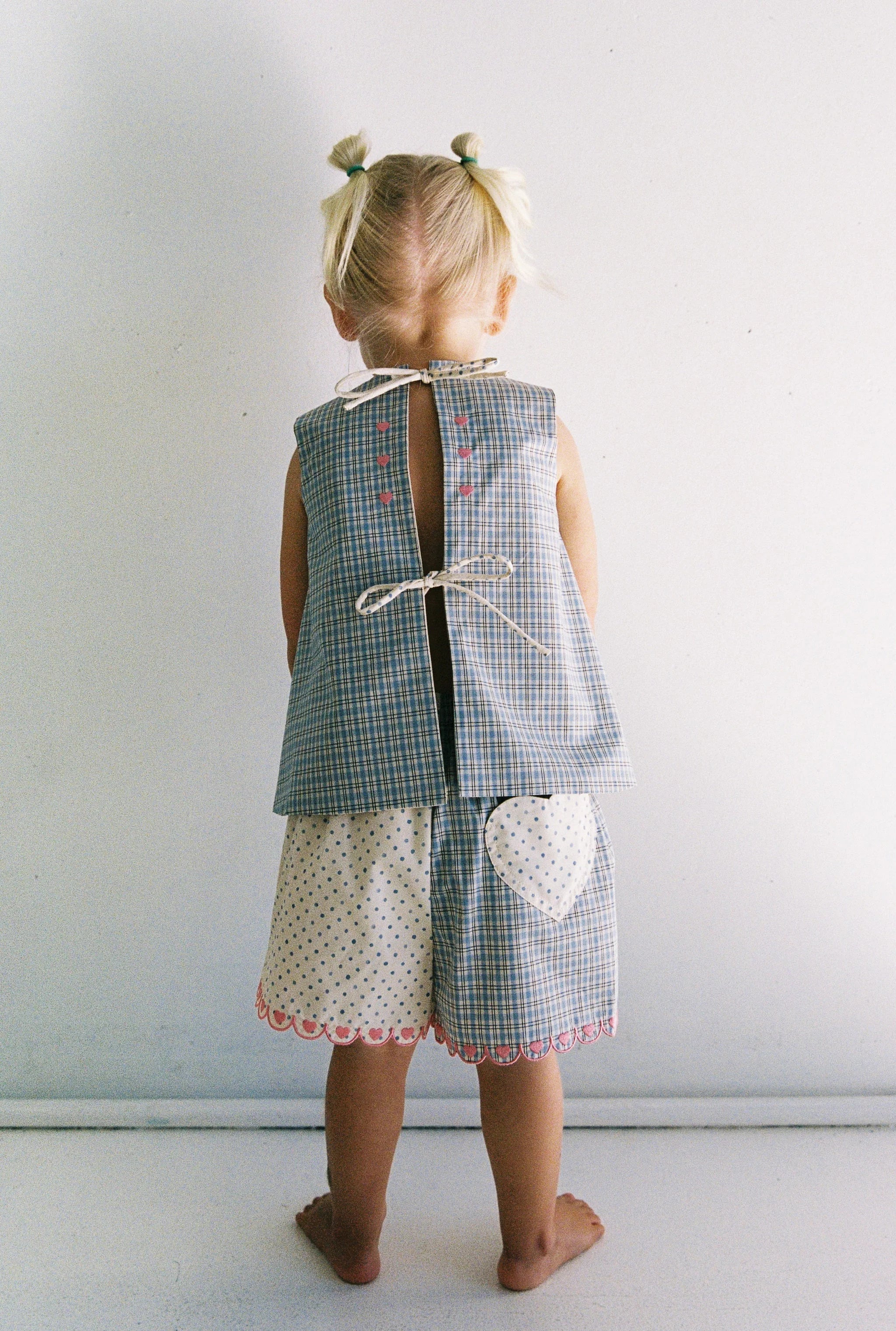 Della Short - blue check by JUNI - with pink scalloped edges