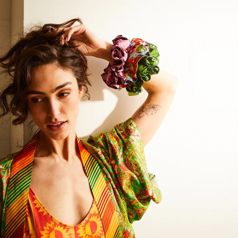 Model putting in Delphine Silk Scrunchie Set by Sage & Clare
