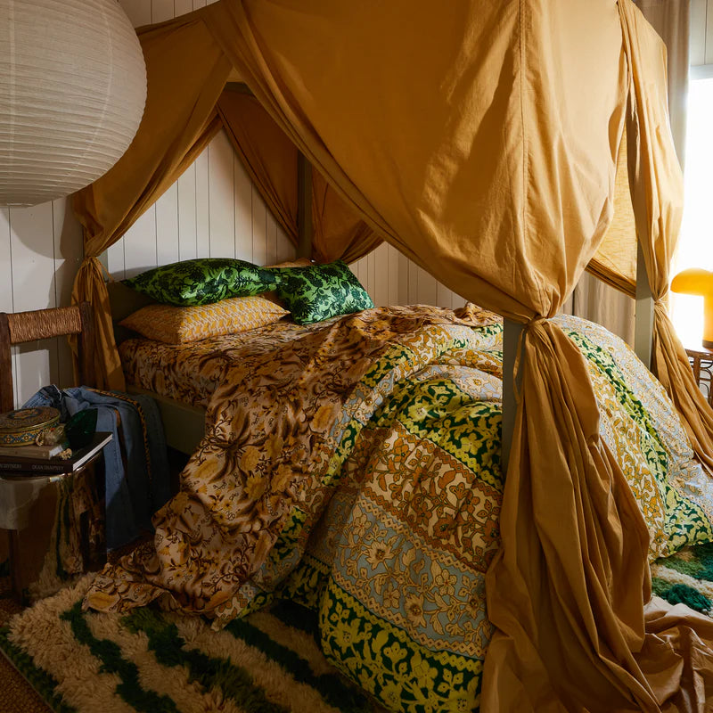 Delphine Silk Pillowcase Key Lime by Sage & Clare on a bed