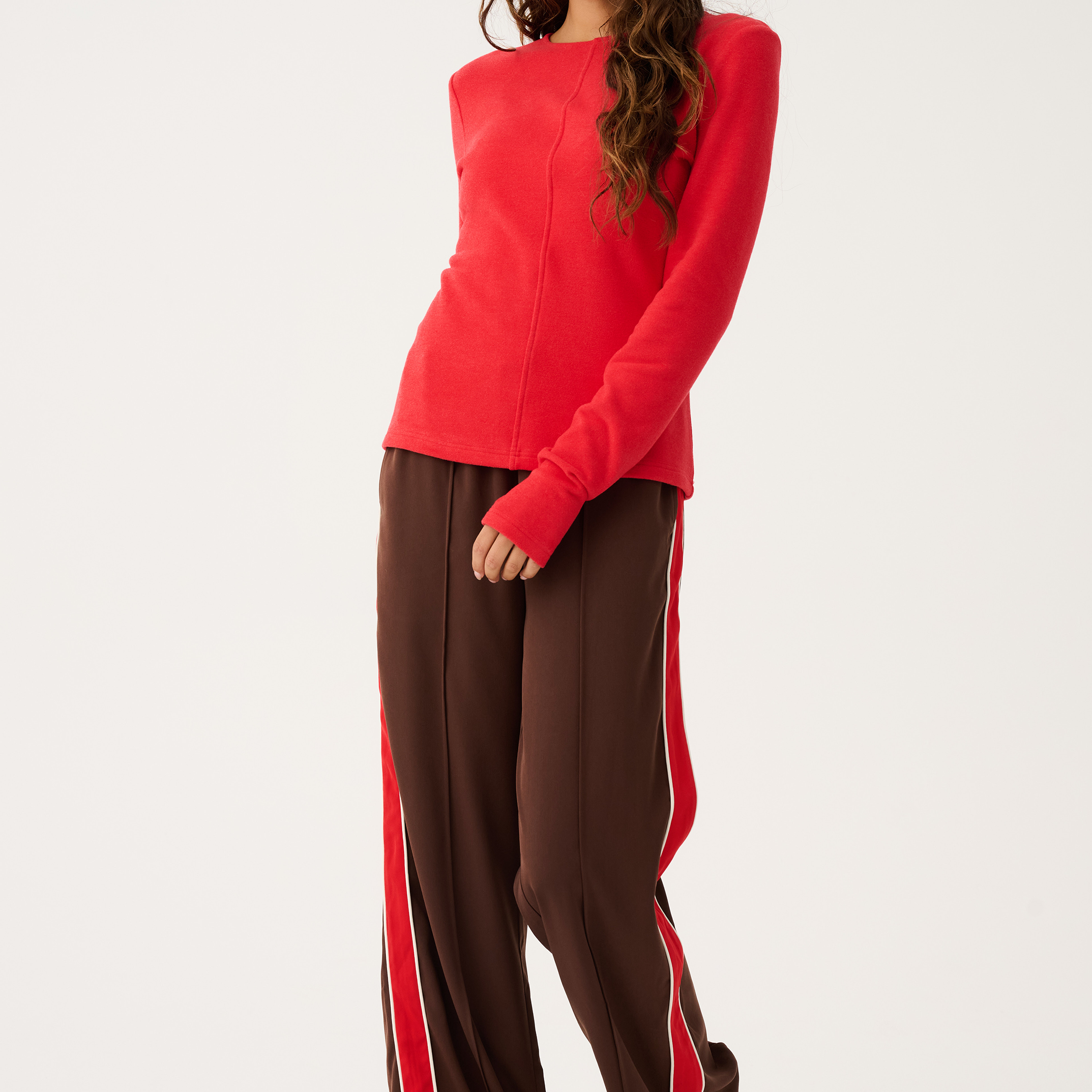 Front view of Dusty Pant in truffle brown with red side stripe detail showing elastic waistband and relaxed fit